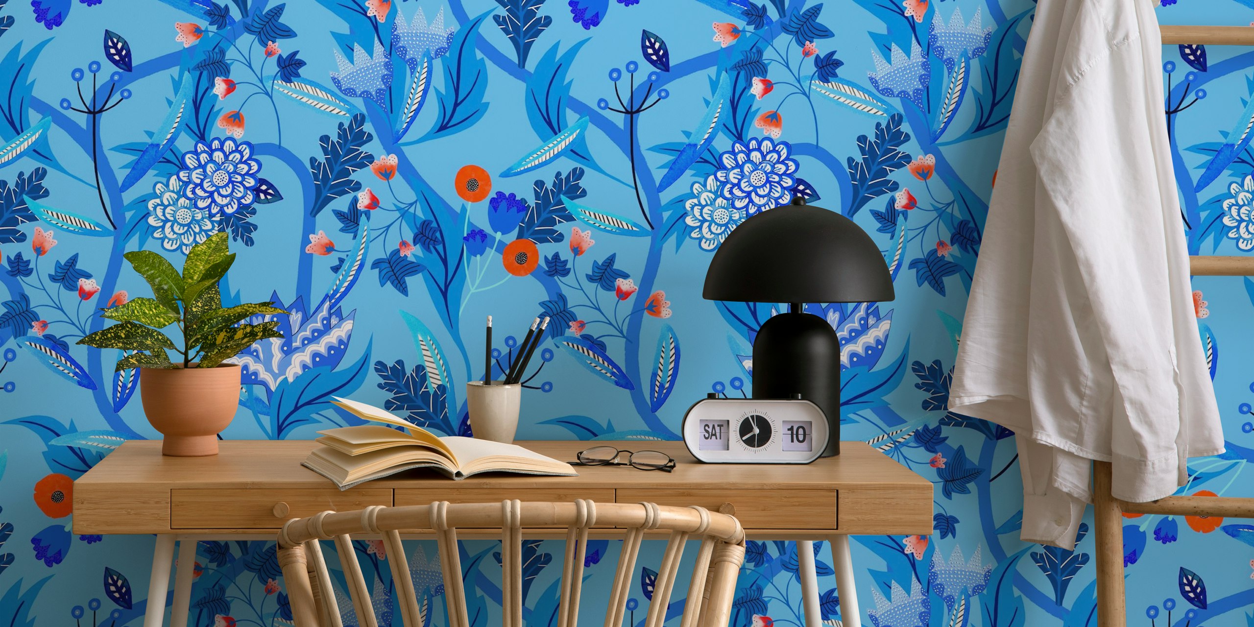 Blue floral design with various flowers and leaves wallpaper