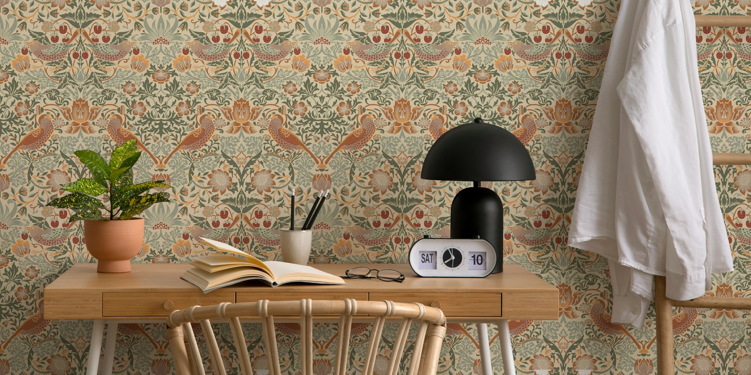Pattern of strawberries and birds in soft greens and reds wallpaper
