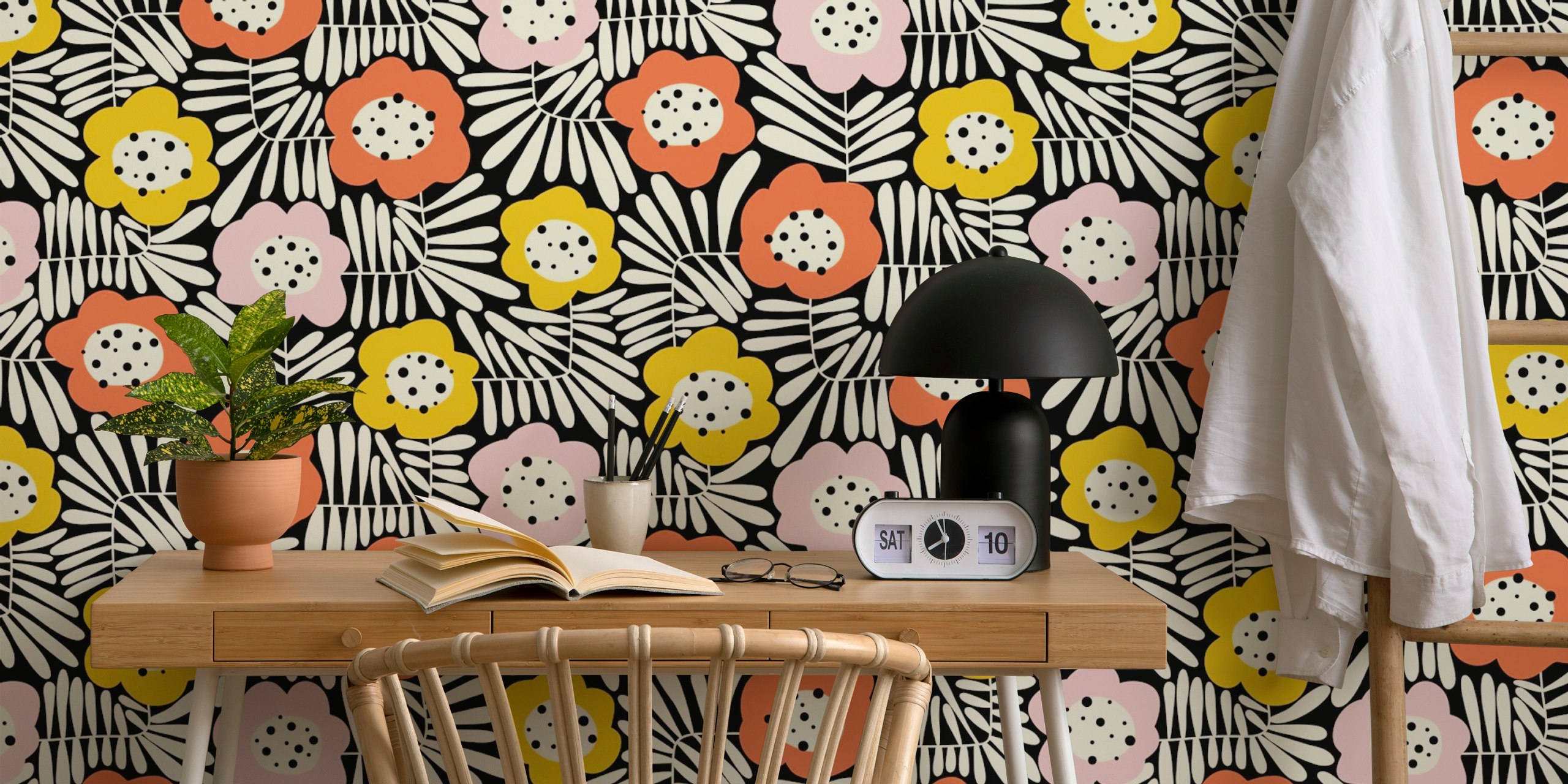 Colorful floral pattern in pink, ochre, and black wallpaper
