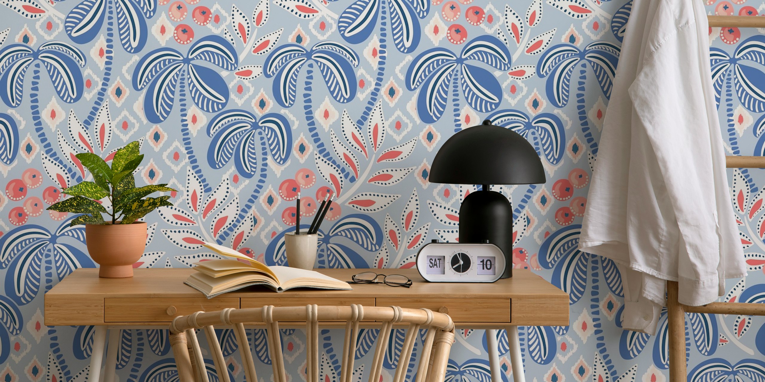 Palm leaves in muted blue and red patterns on light background wallpaper
