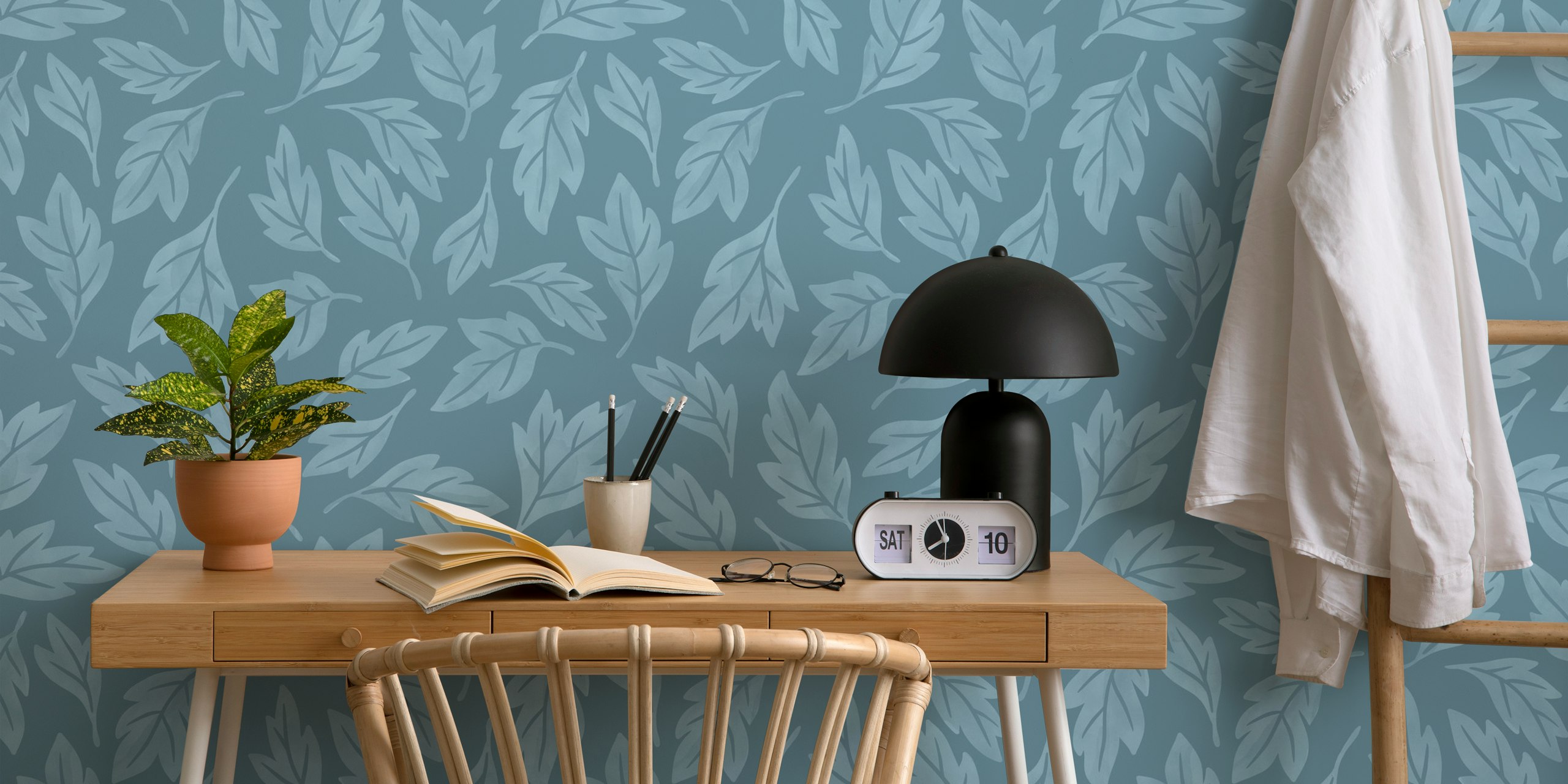Blue leaves on a soft blue background wallpaper