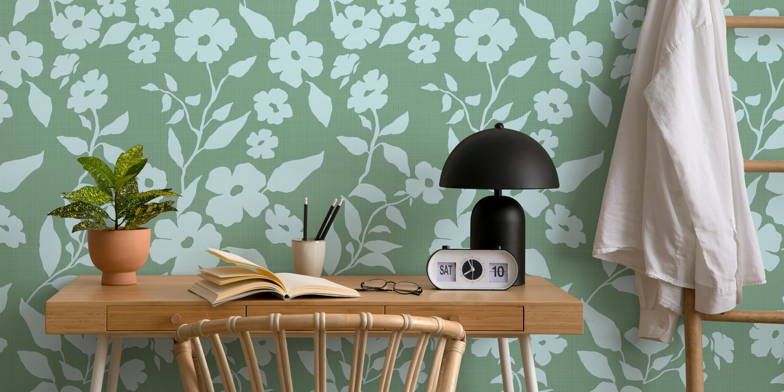 Blue flowers with green leaves on a soft green background wallpaper