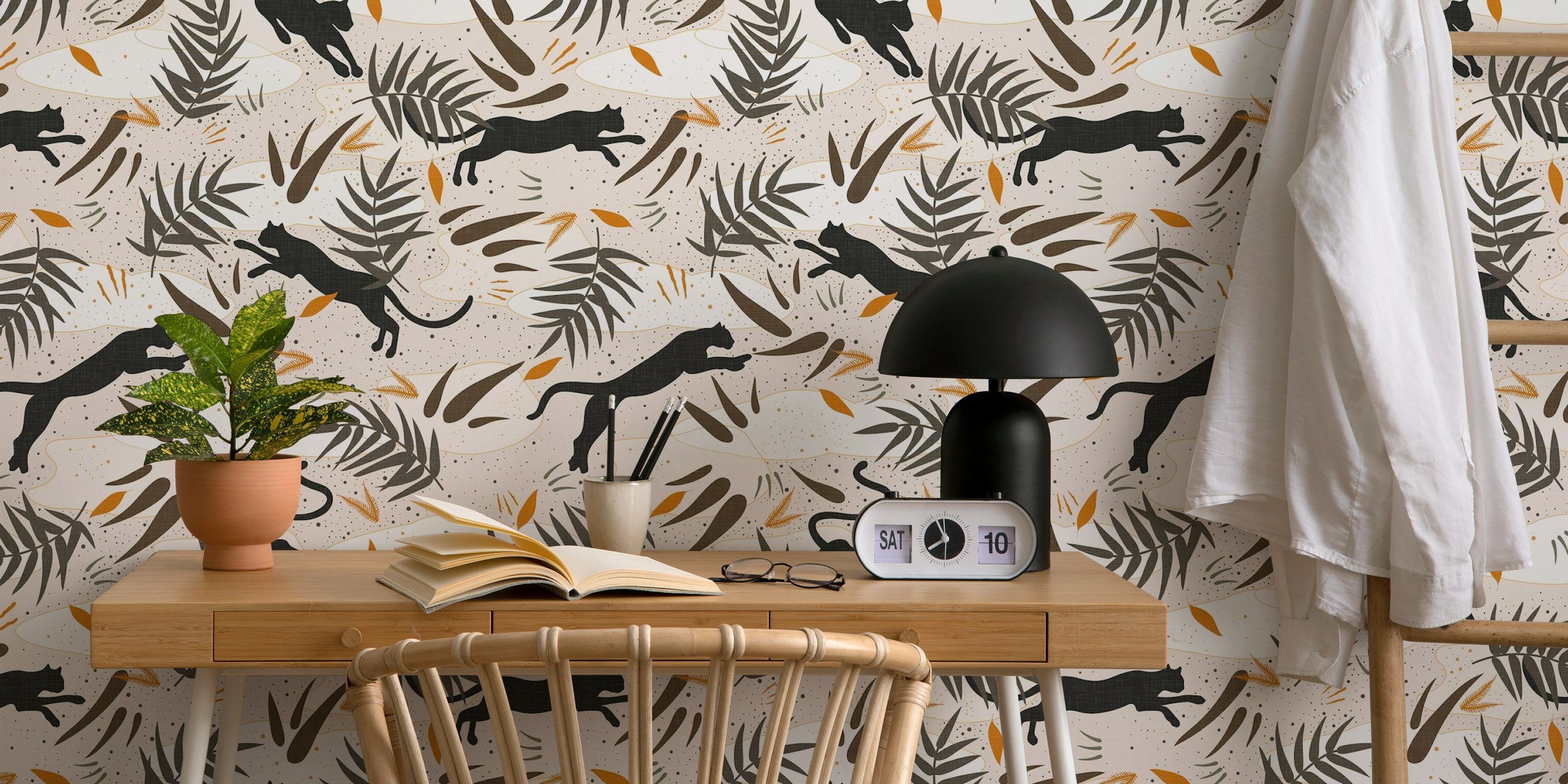 Black panthers and lush green leaves on beige background wallpaper