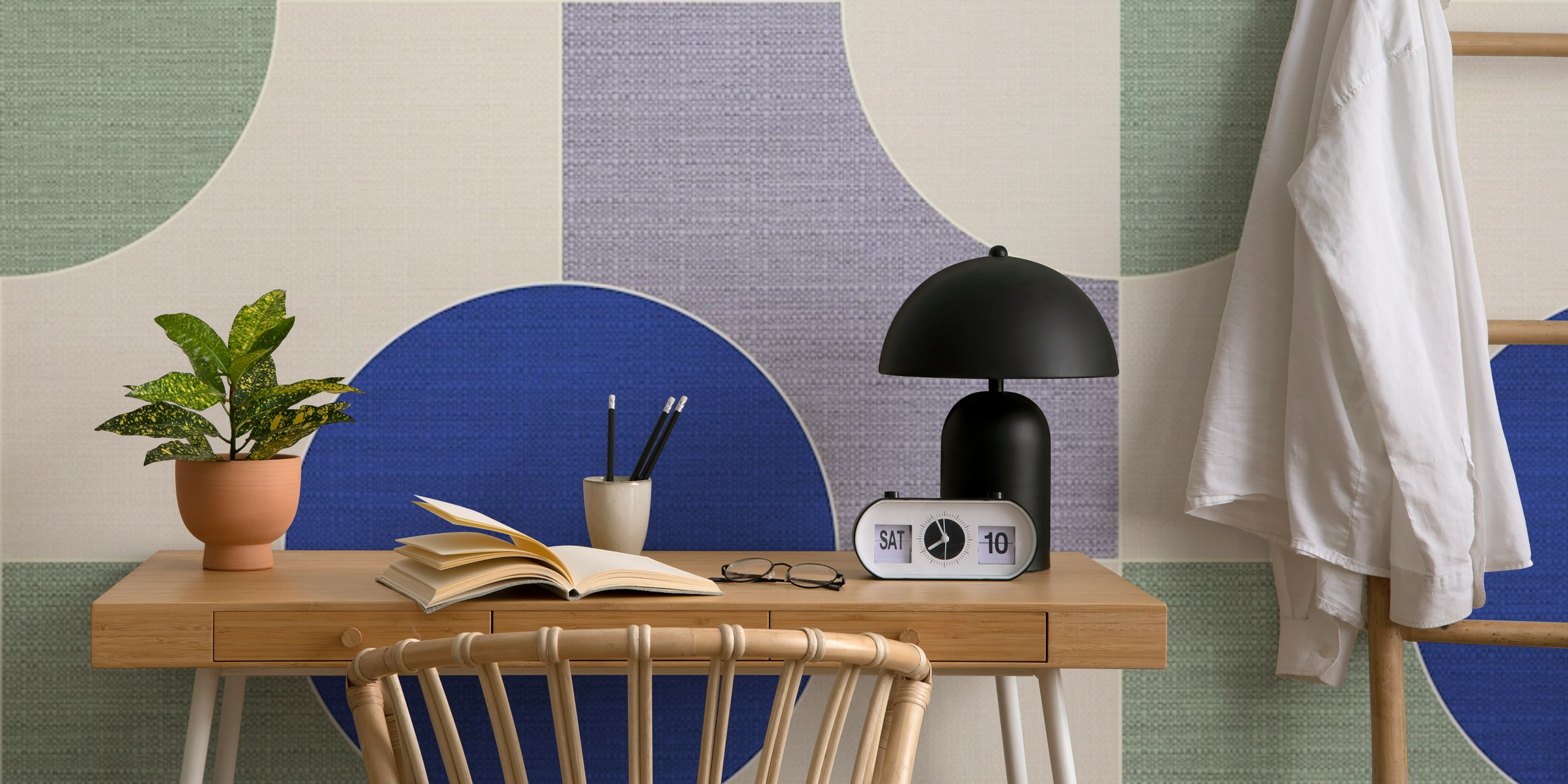 Geometric shapes in blue, green, and cream wallpaper