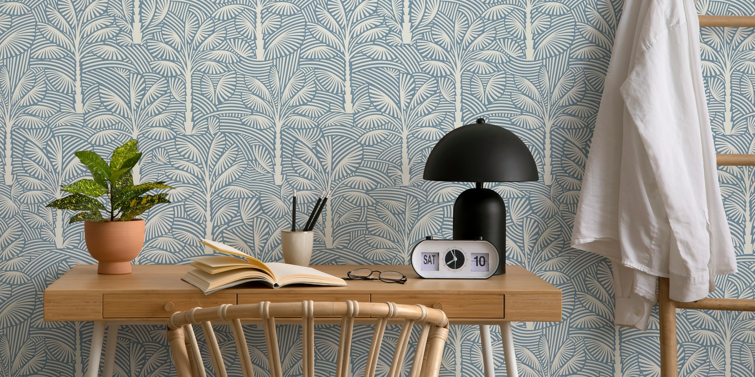 Tropical palm leaves pattern in light blue and white wallpaper