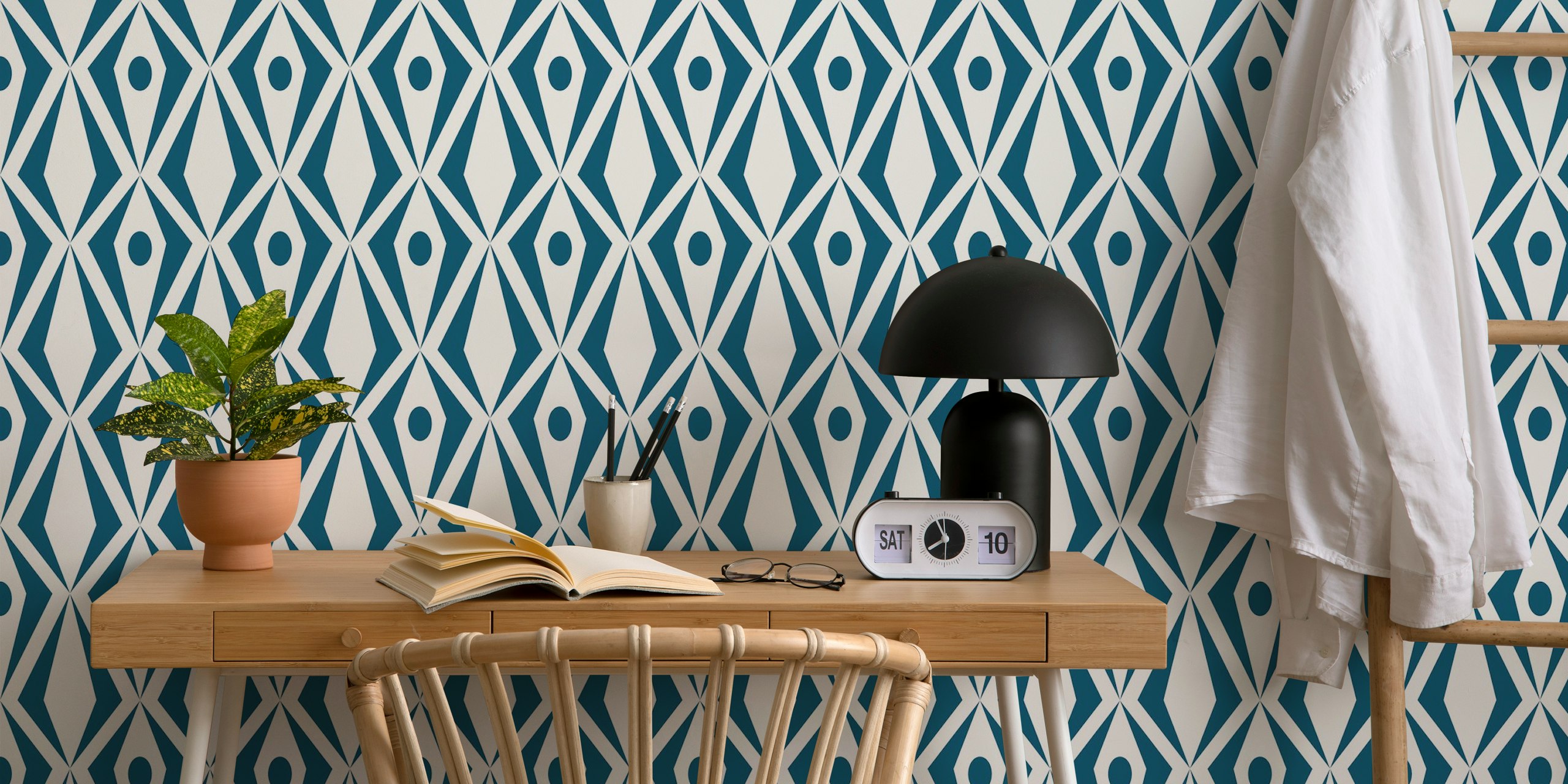 Teal geometric diamond wallpaper in a room