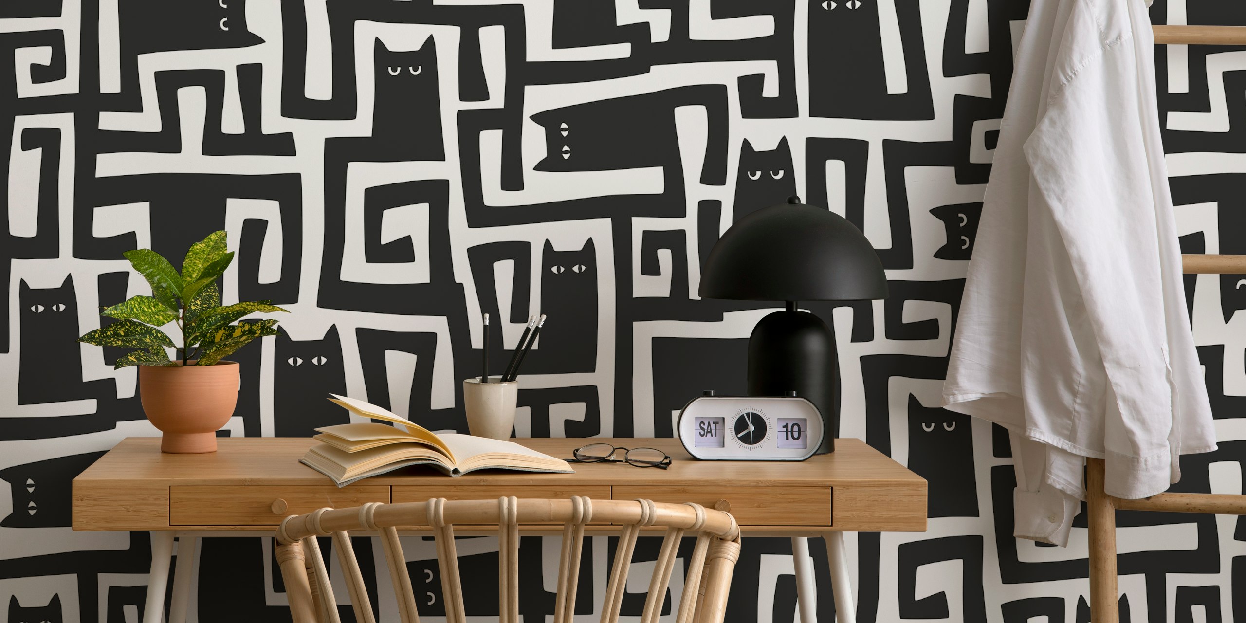 Black cats with maze patterns on white background wallpaper
