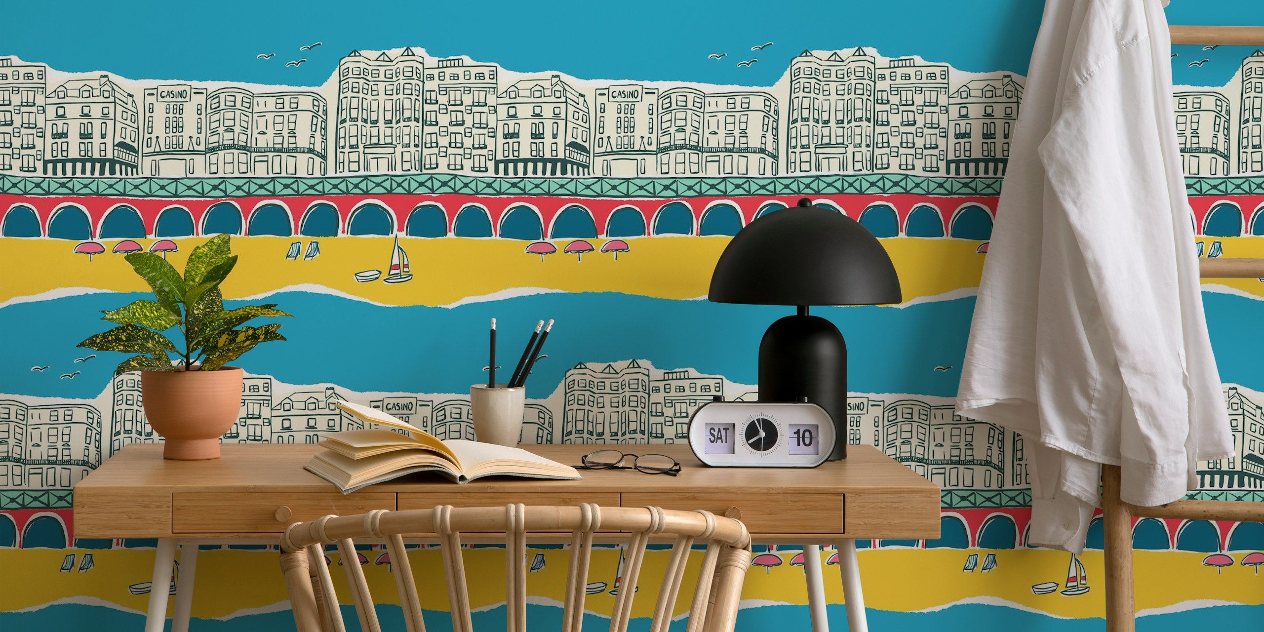 Brighton Beach seaside scene with colorful buildings, blue sky, and yellow sand wallpaper