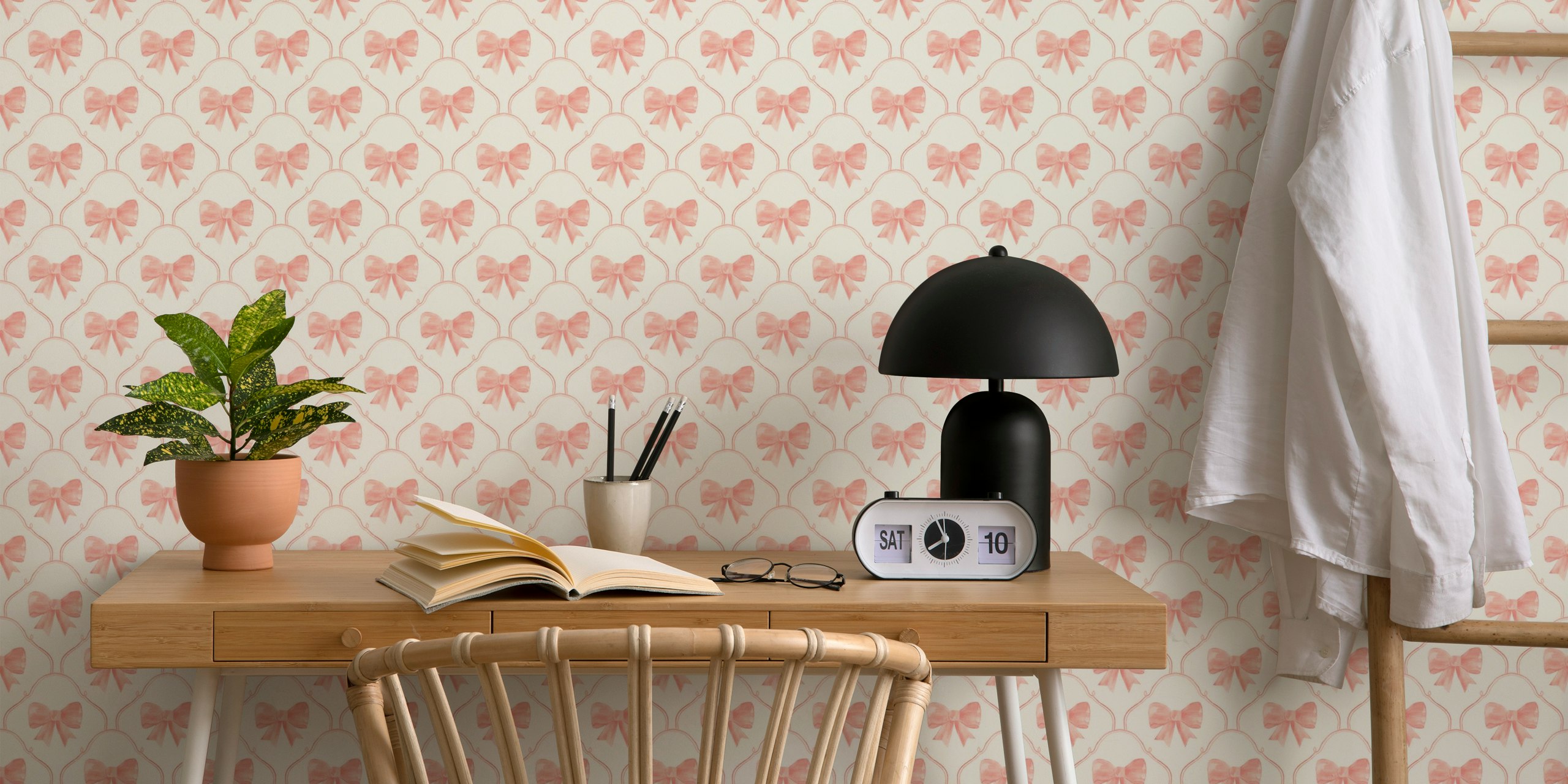 Blush pink bows with scalloped outlines on a cream wallpaper