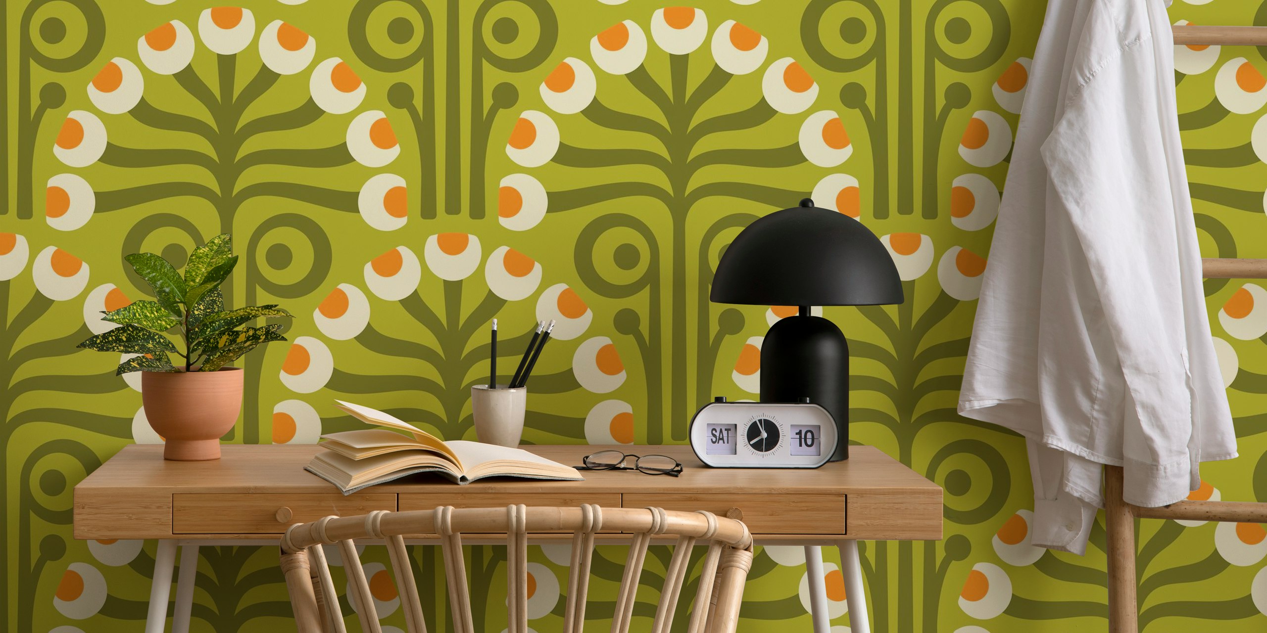 Floral design with green background and orange accents wallpaper
