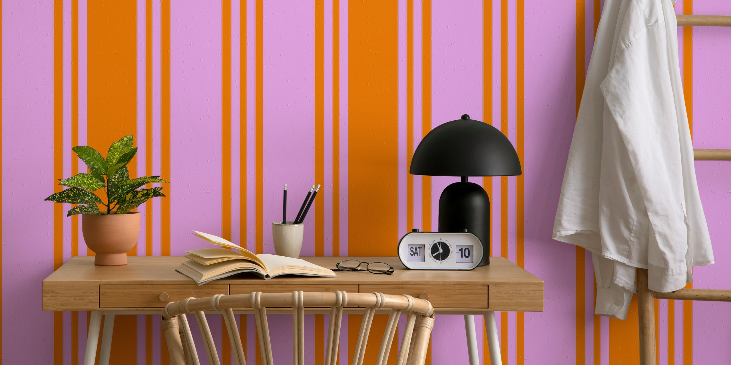 Bold orange and pink striped wallpaper in a room