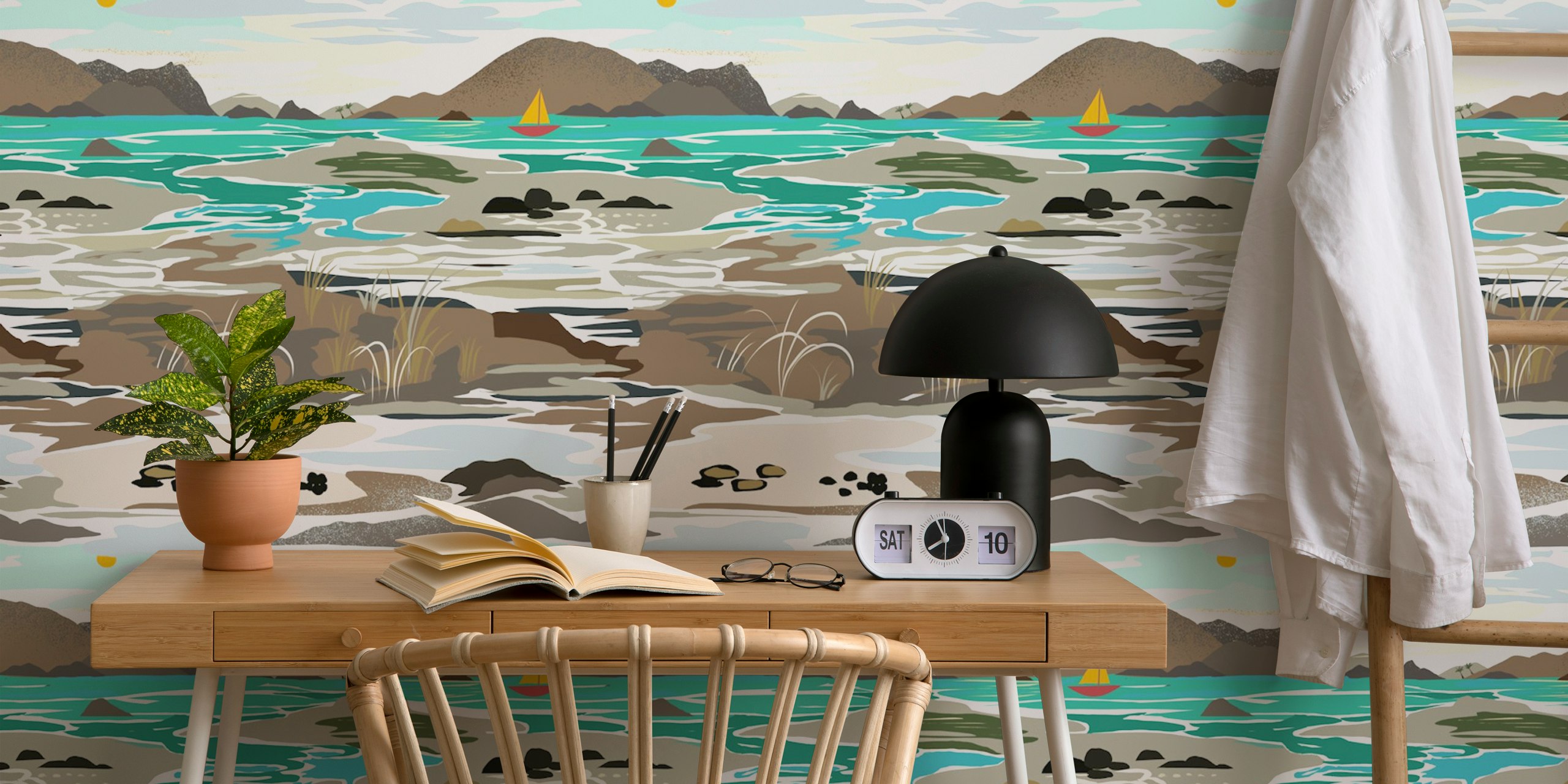 Coastal landscape with teal water, brown rocks, and mountains wallpaper