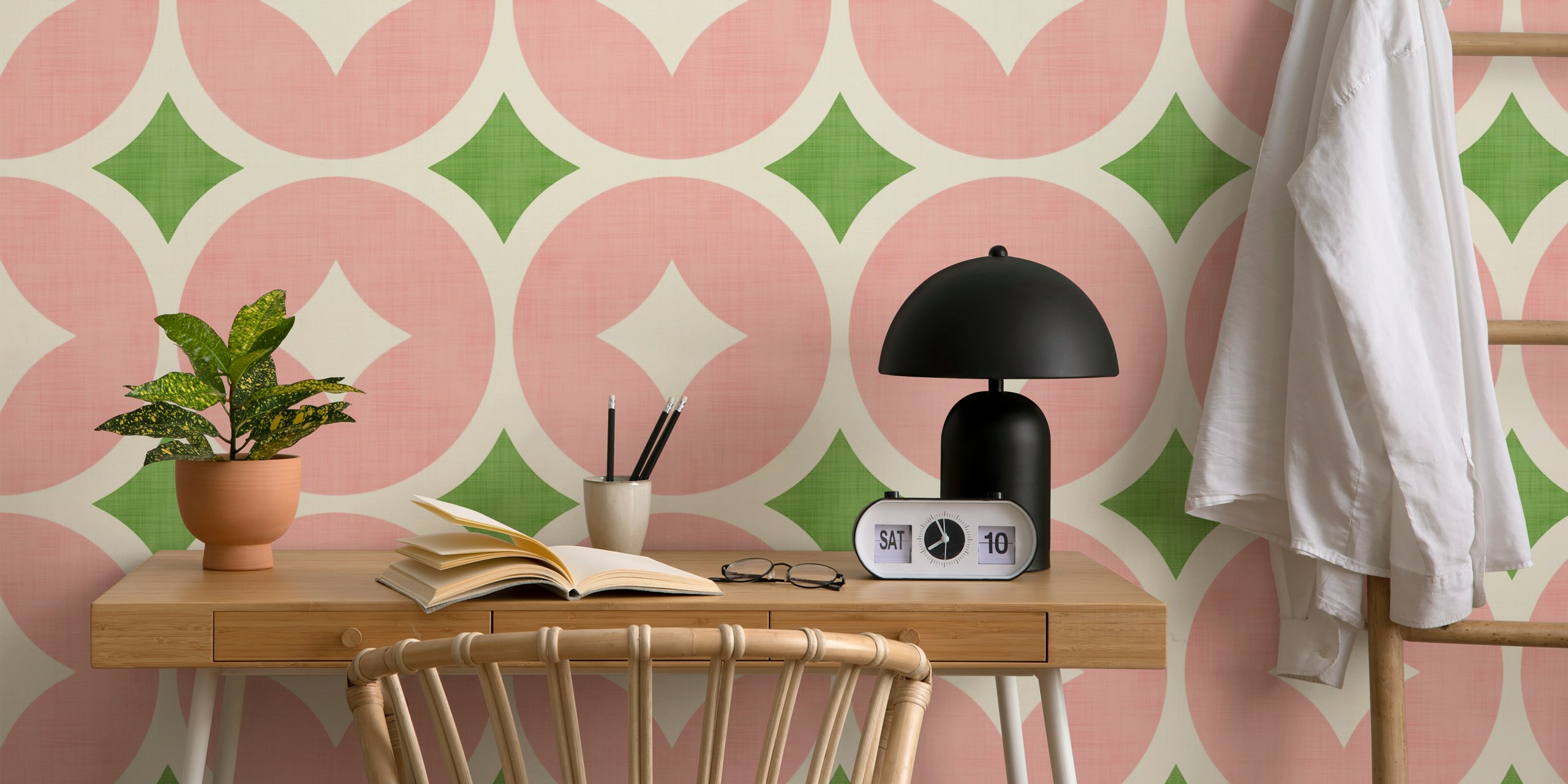 Pink and green geo mid-century modern wallpaper in a room