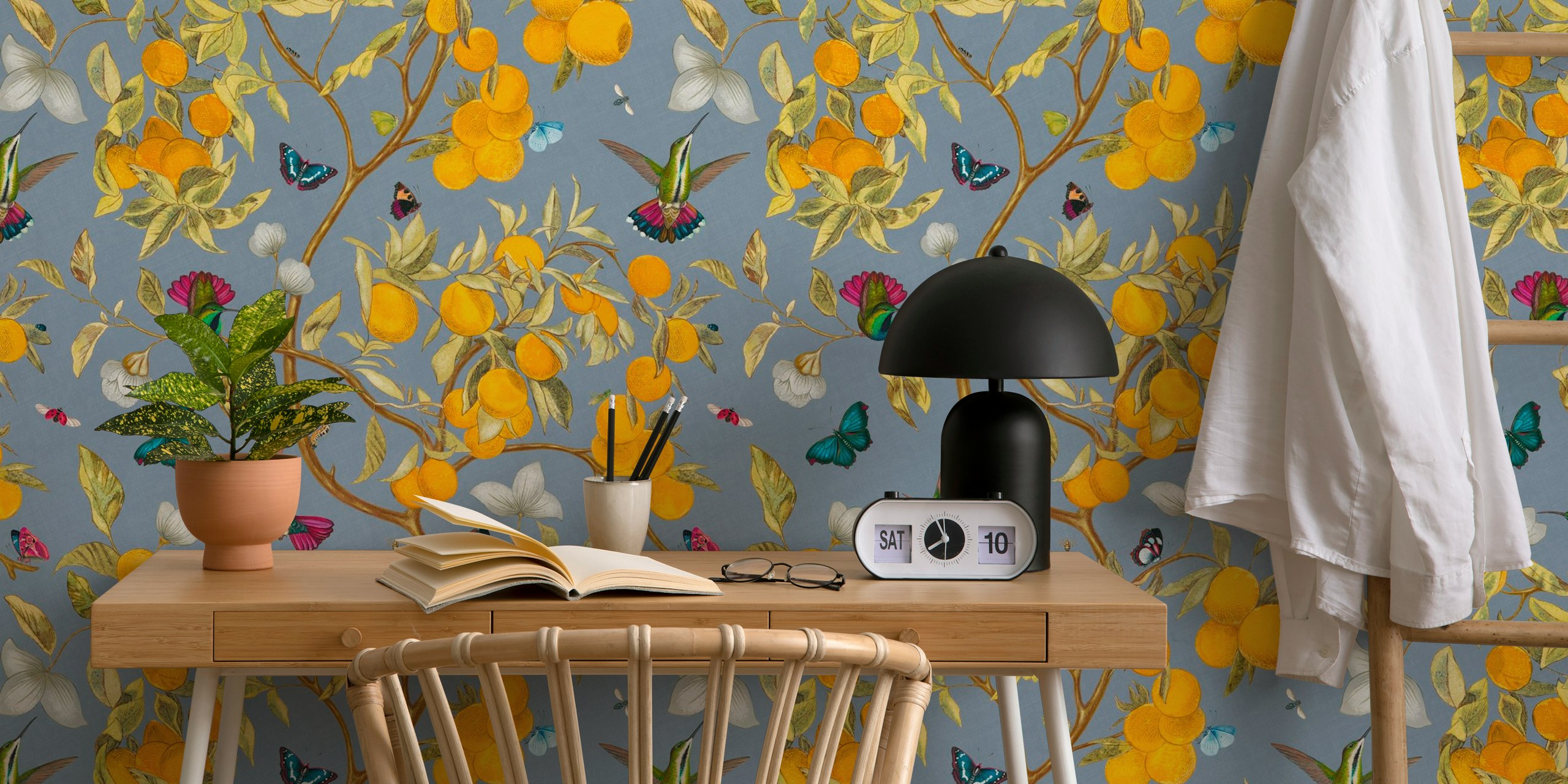 Hummingbirds, lemons, and butterflies on blue background wallpaper