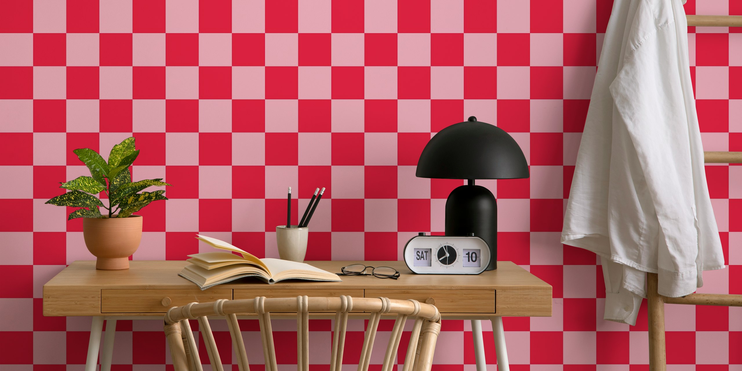 Checkerboard pink and red wallpaper in a room