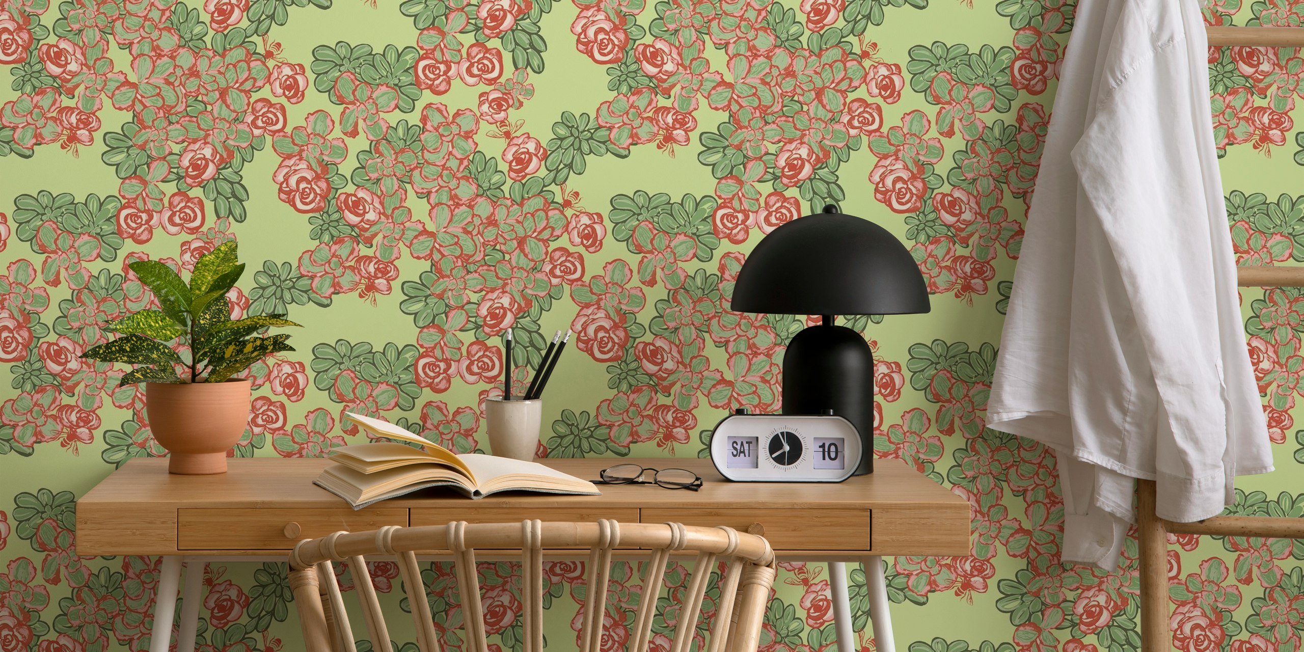 Floral pattern with pink flowers and green leaves on light green background wallpaper