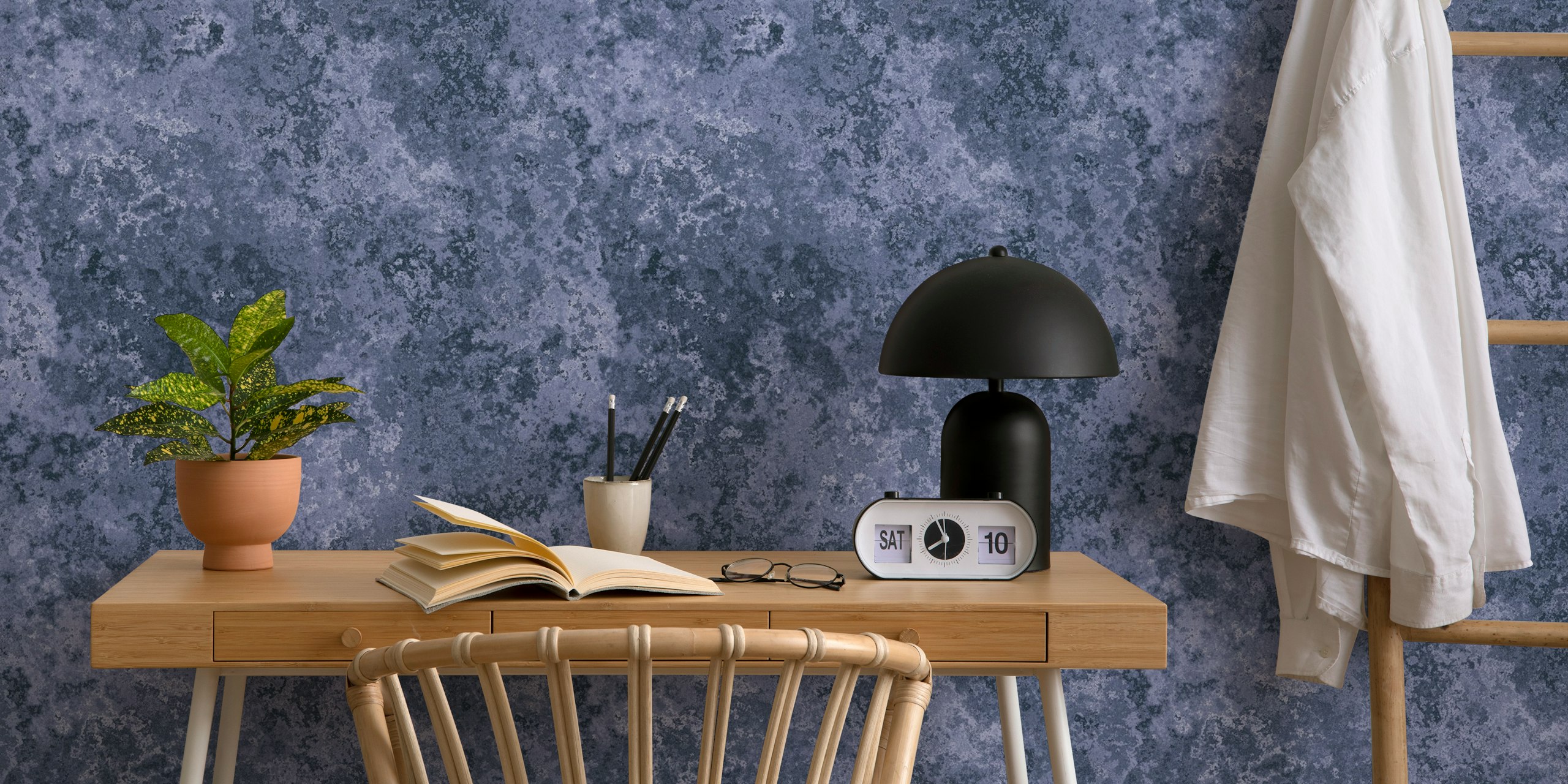 Subtle moss texture navy blue wallpaper in a room