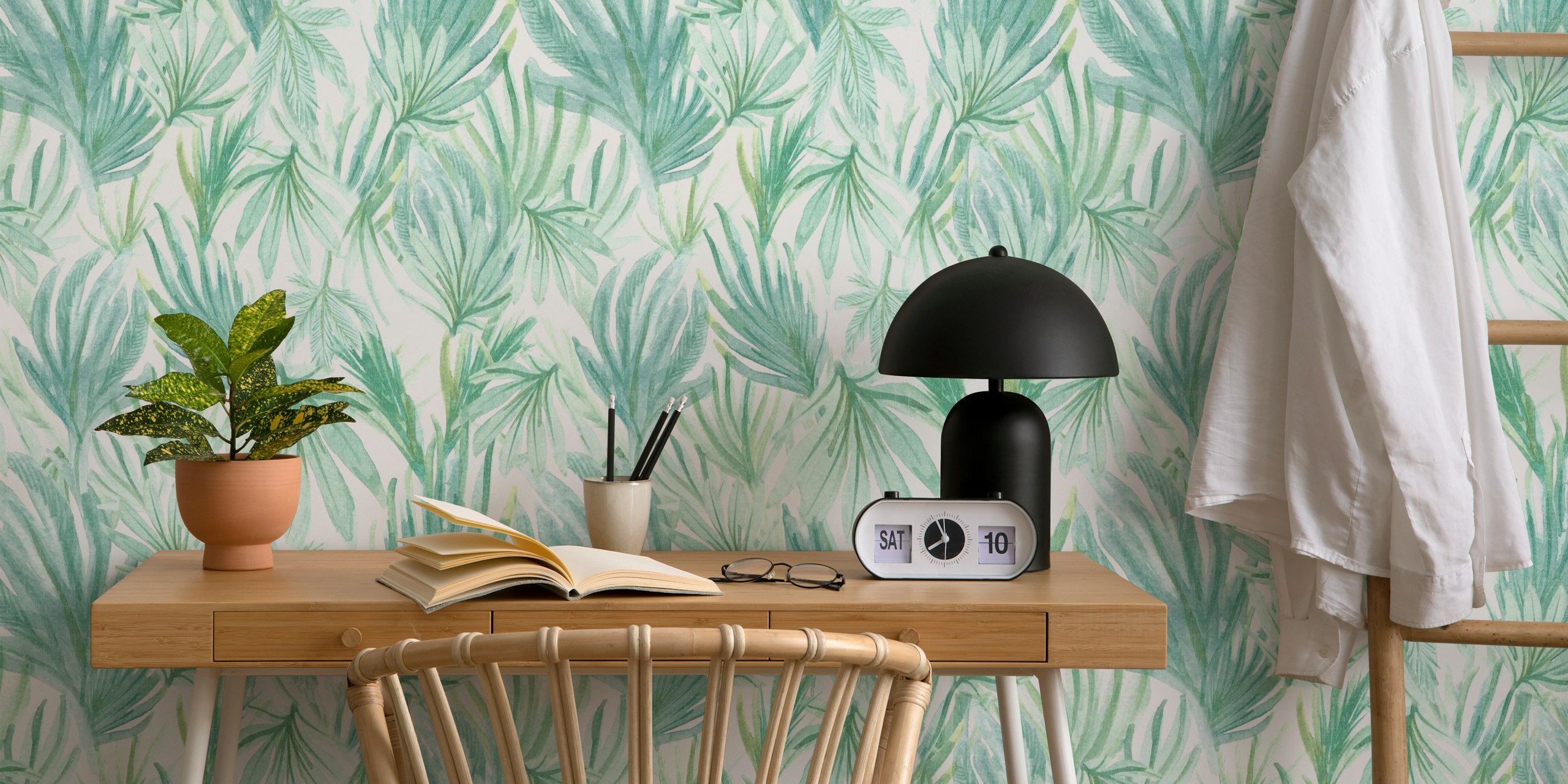 Watercolour jungle leaves mural with soft green tones