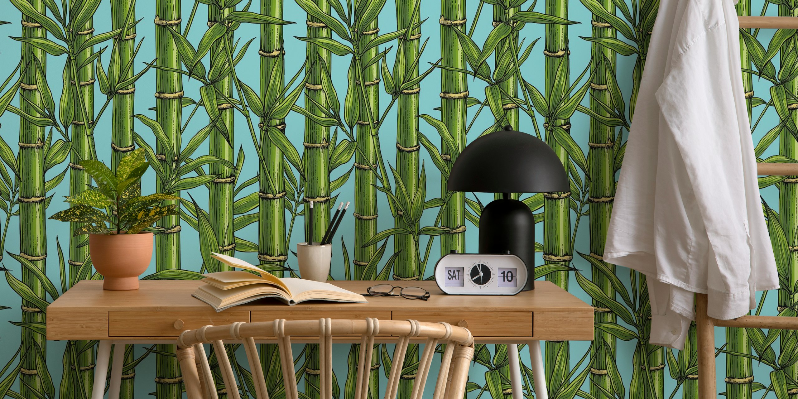 Bamboo forest patterns in green on light blue wallpaper