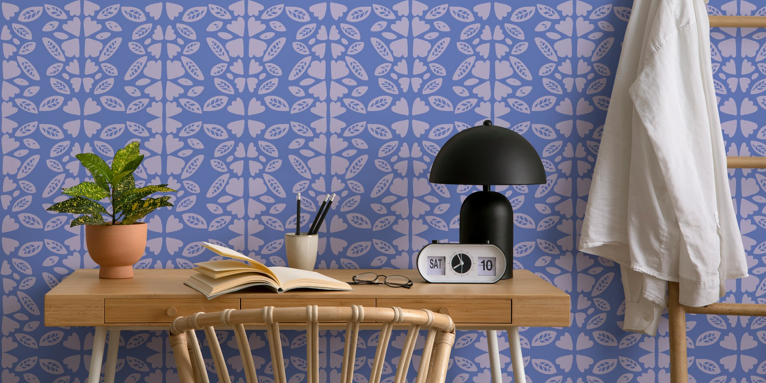 Periwinkle blue wall mural with symmetrical leaf and heart patterns