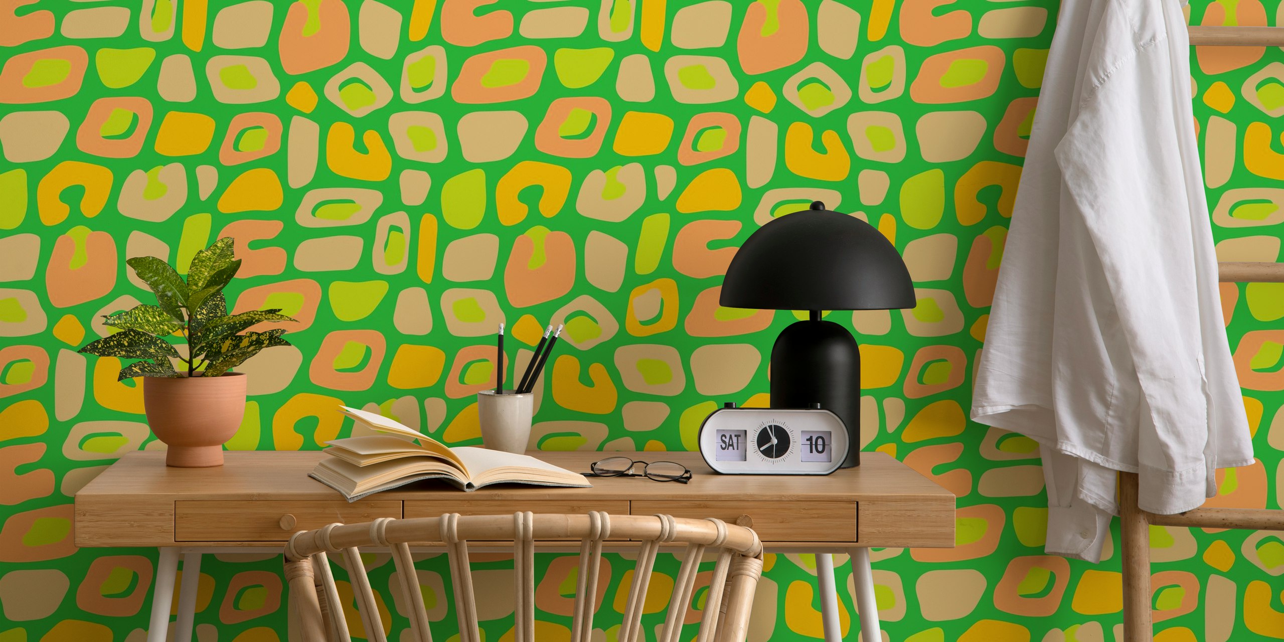 Colorful leopard print patterns in green, peach, and yellow wallpaper