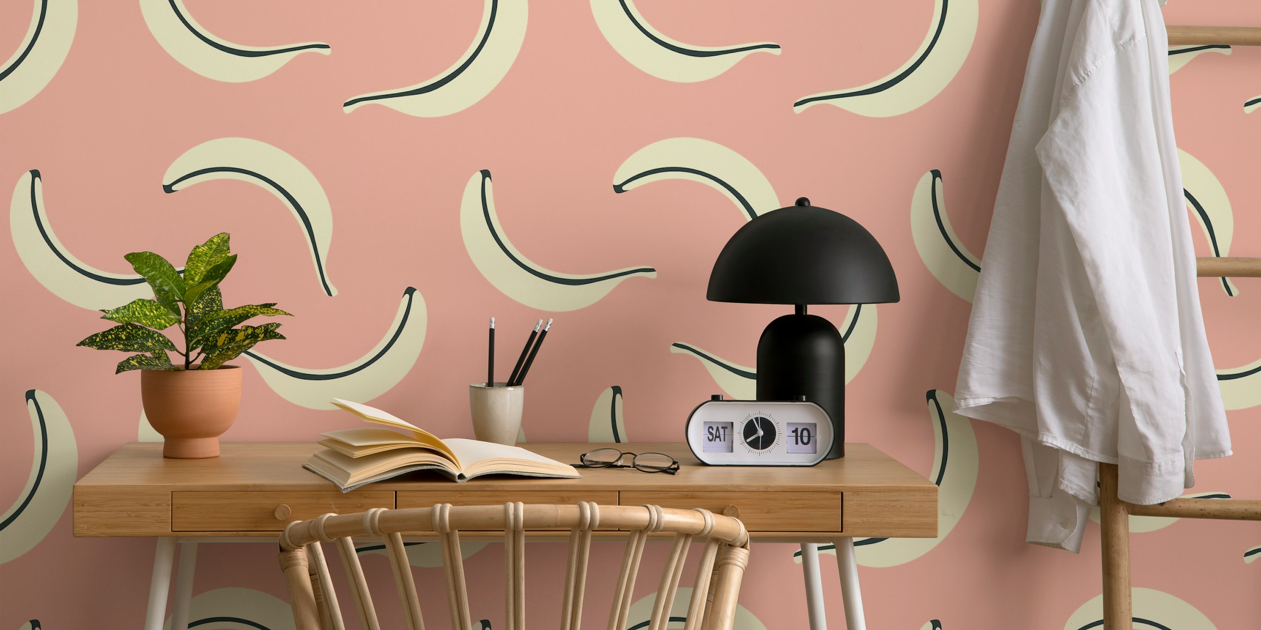 Tropical pattern of yellow bananas on a pink background wallpaper