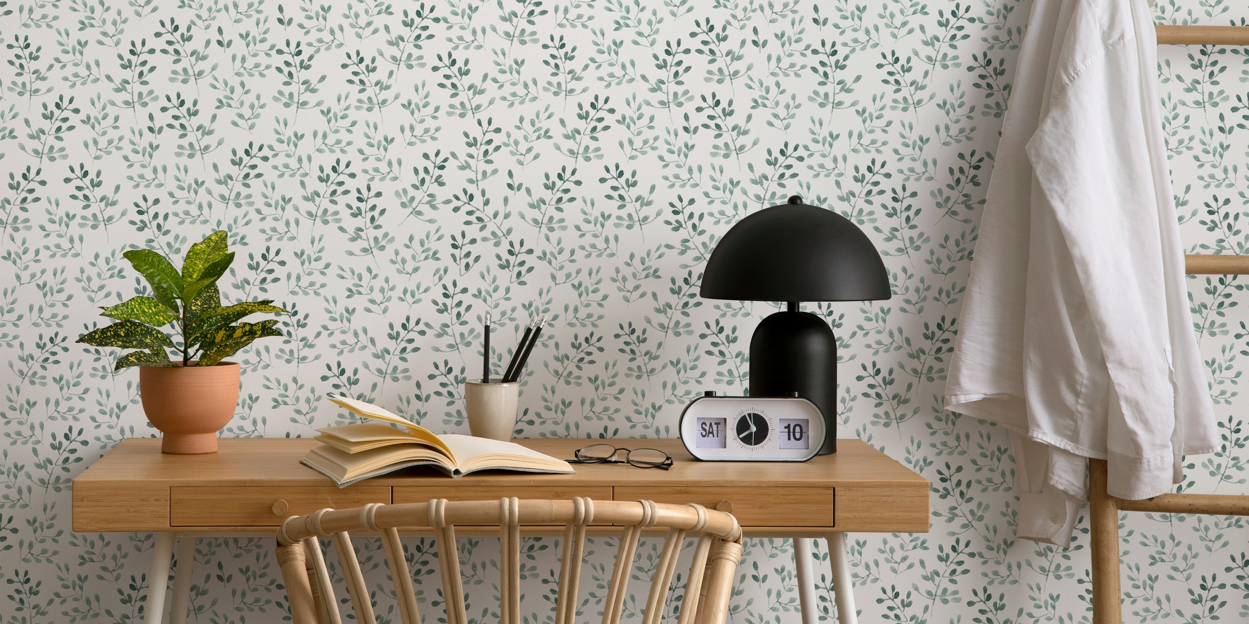 Watercolor leaves pattern in light gray on white wallpaper
