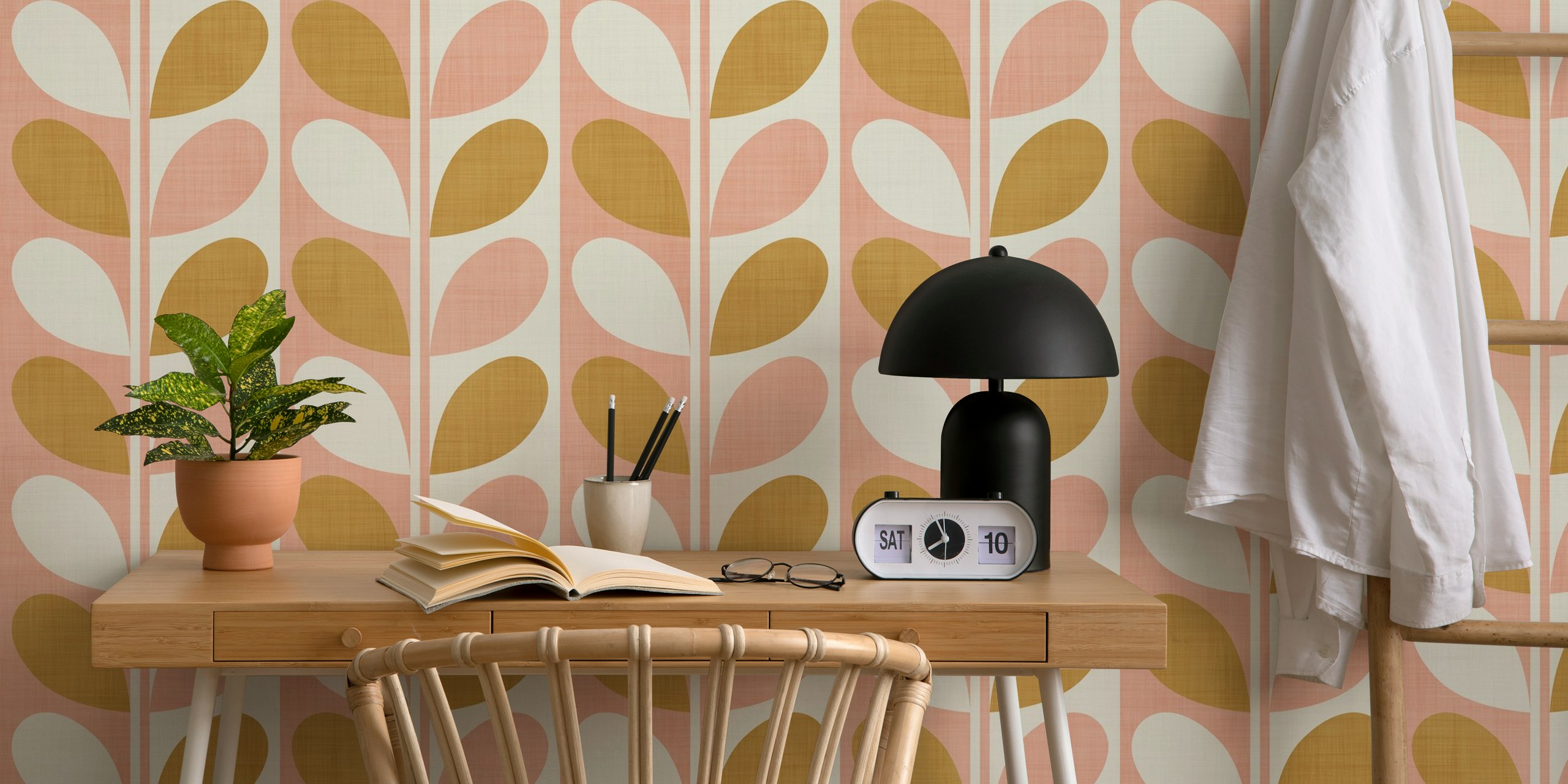 Blush and gold leaf pattern wallpaper in mid-century modern style