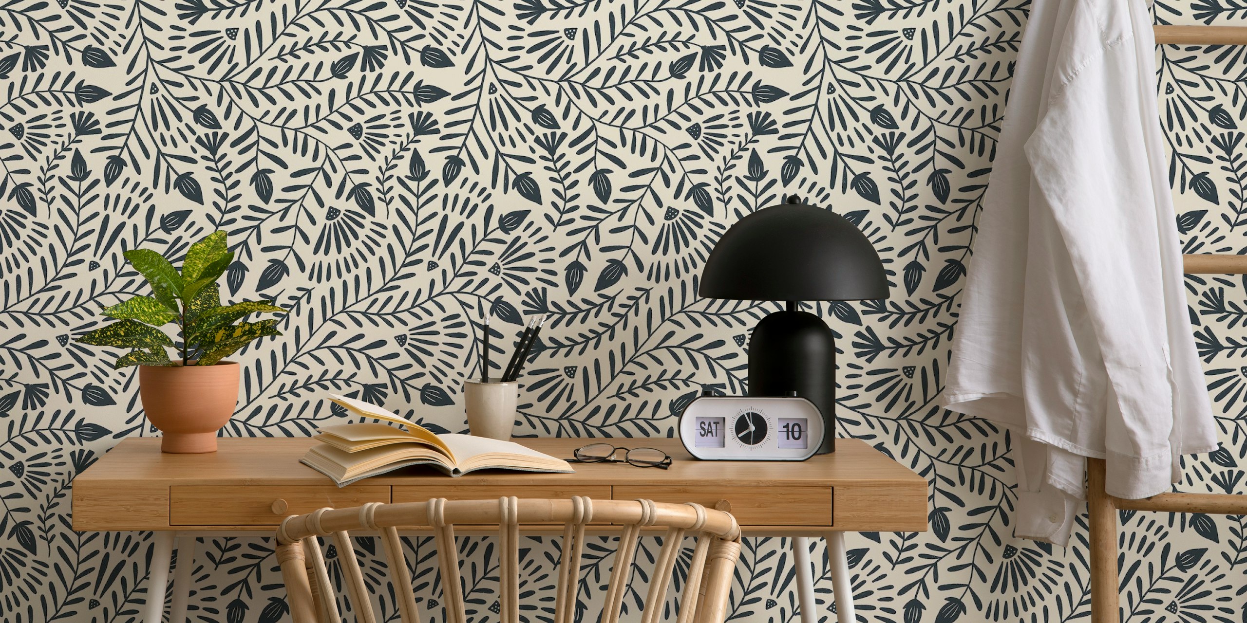 Monochrome floral pattern in dark blue on light beige wallpaper