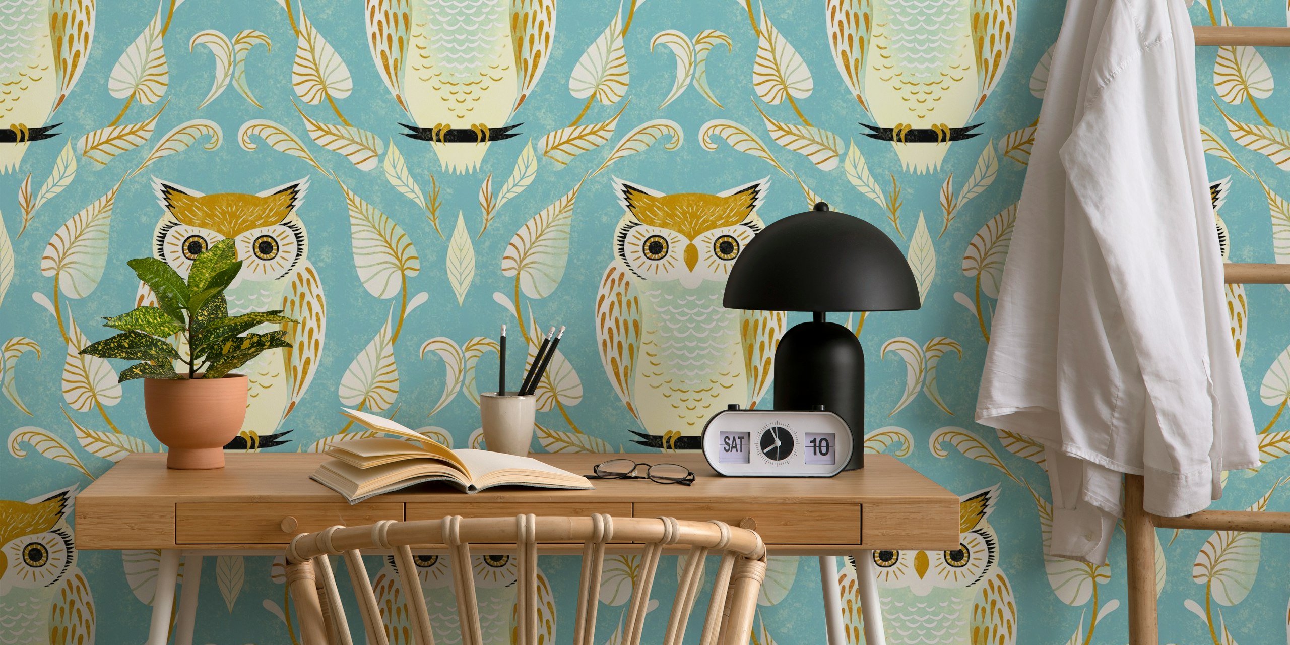 Colorful snow owl and leaf pattern on aqua blue wallpaper