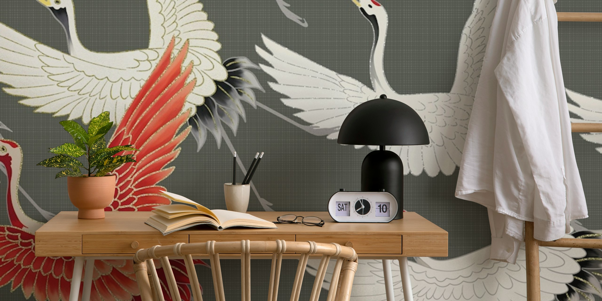 Artistic depiction of Japanese cranes in flight with a standout red crane against a grey background.