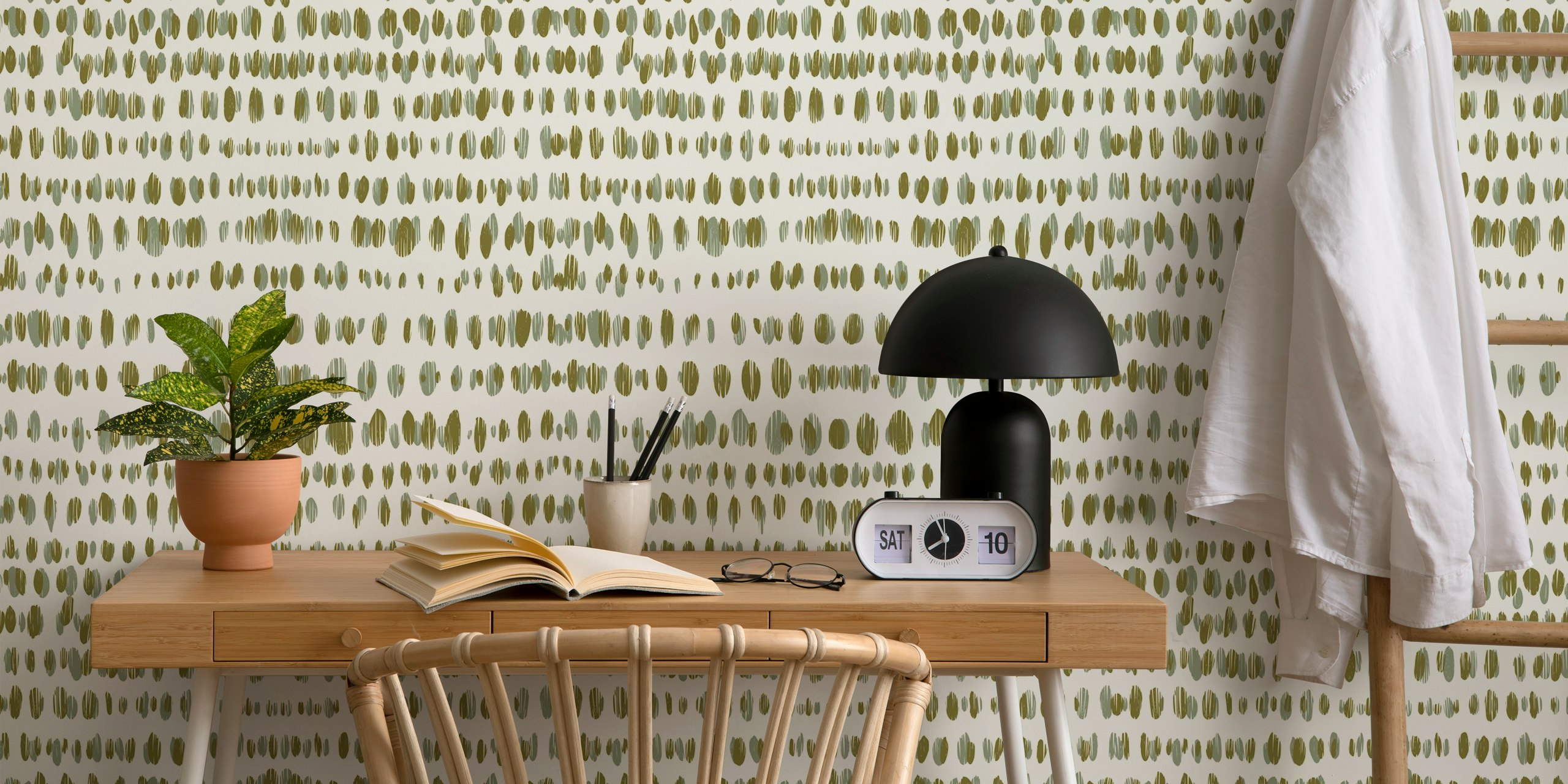 Green dotted pattern on cream wallpaper showcasing wildlife design