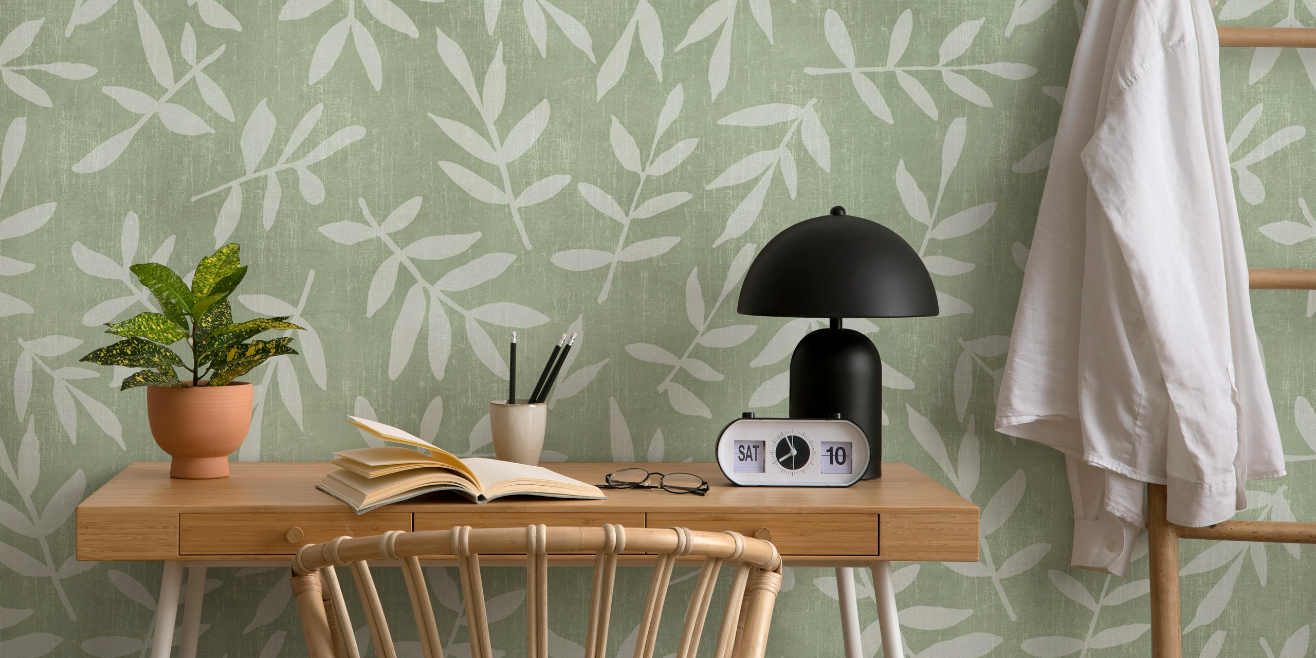 White leaf pattern on soft green background in botanical style wallpaper