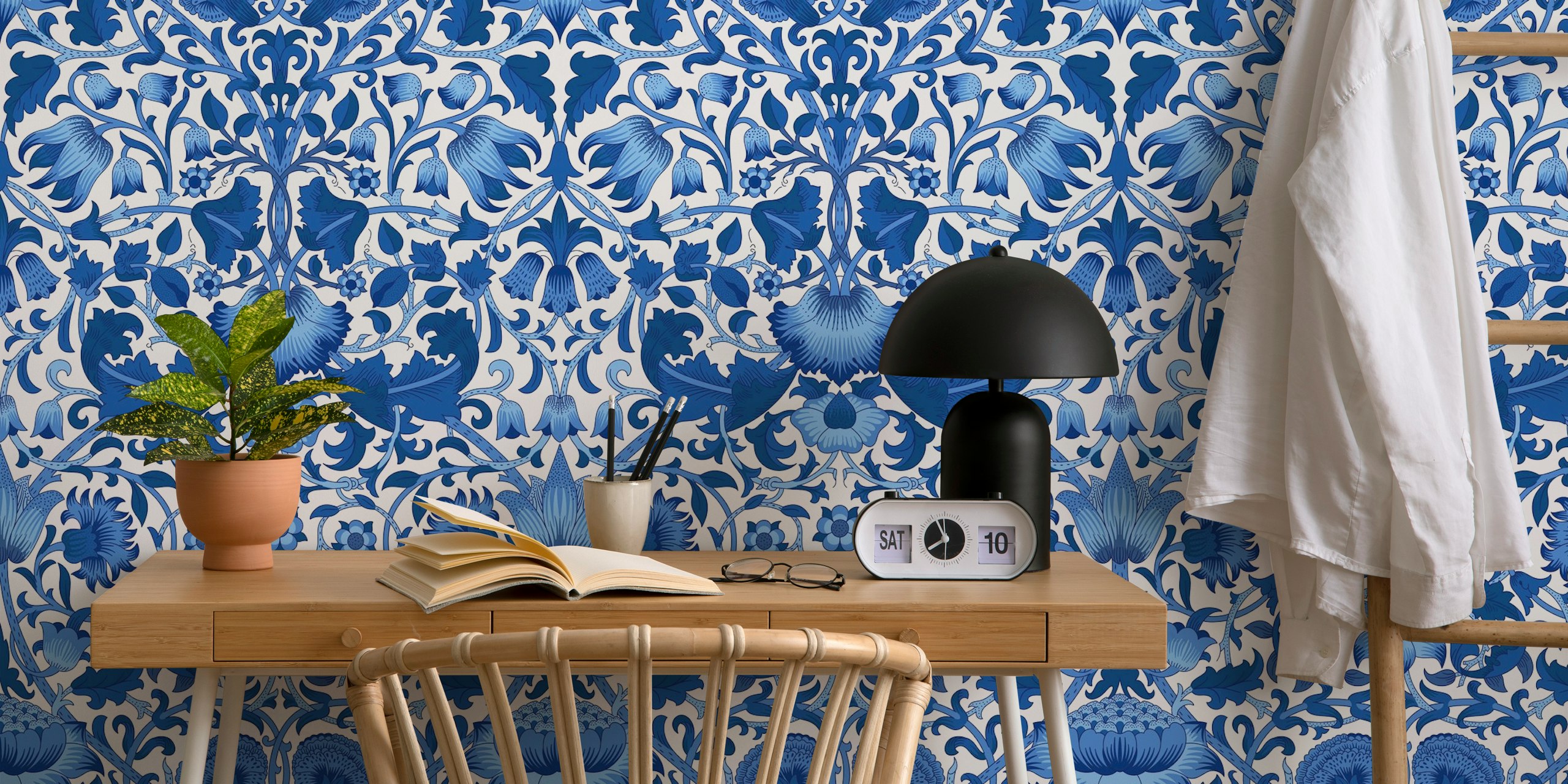 Blue floral patterns on white background wallpaper