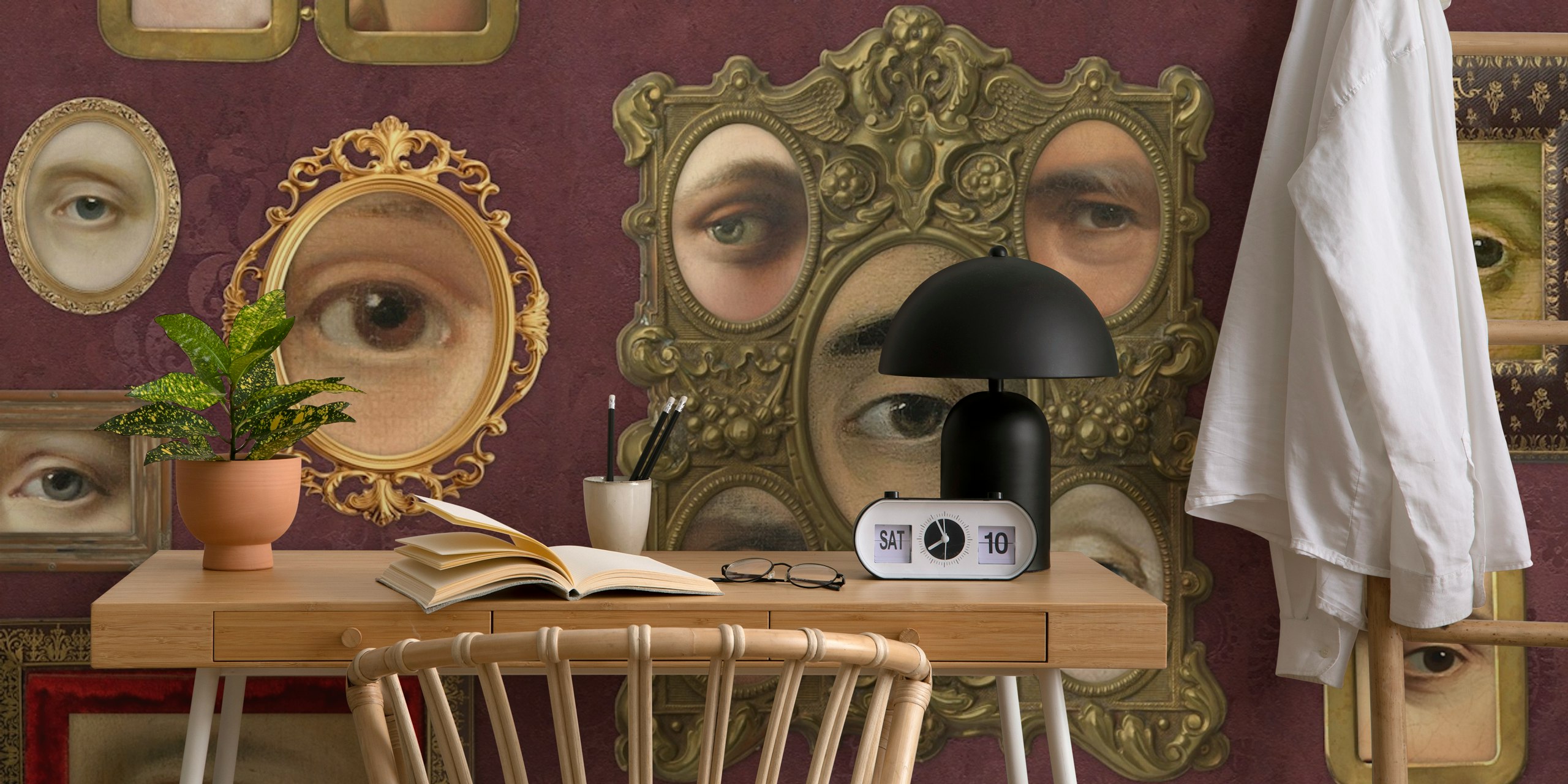 Victorian eye portraits in ornate frames on burgundy wallpaper