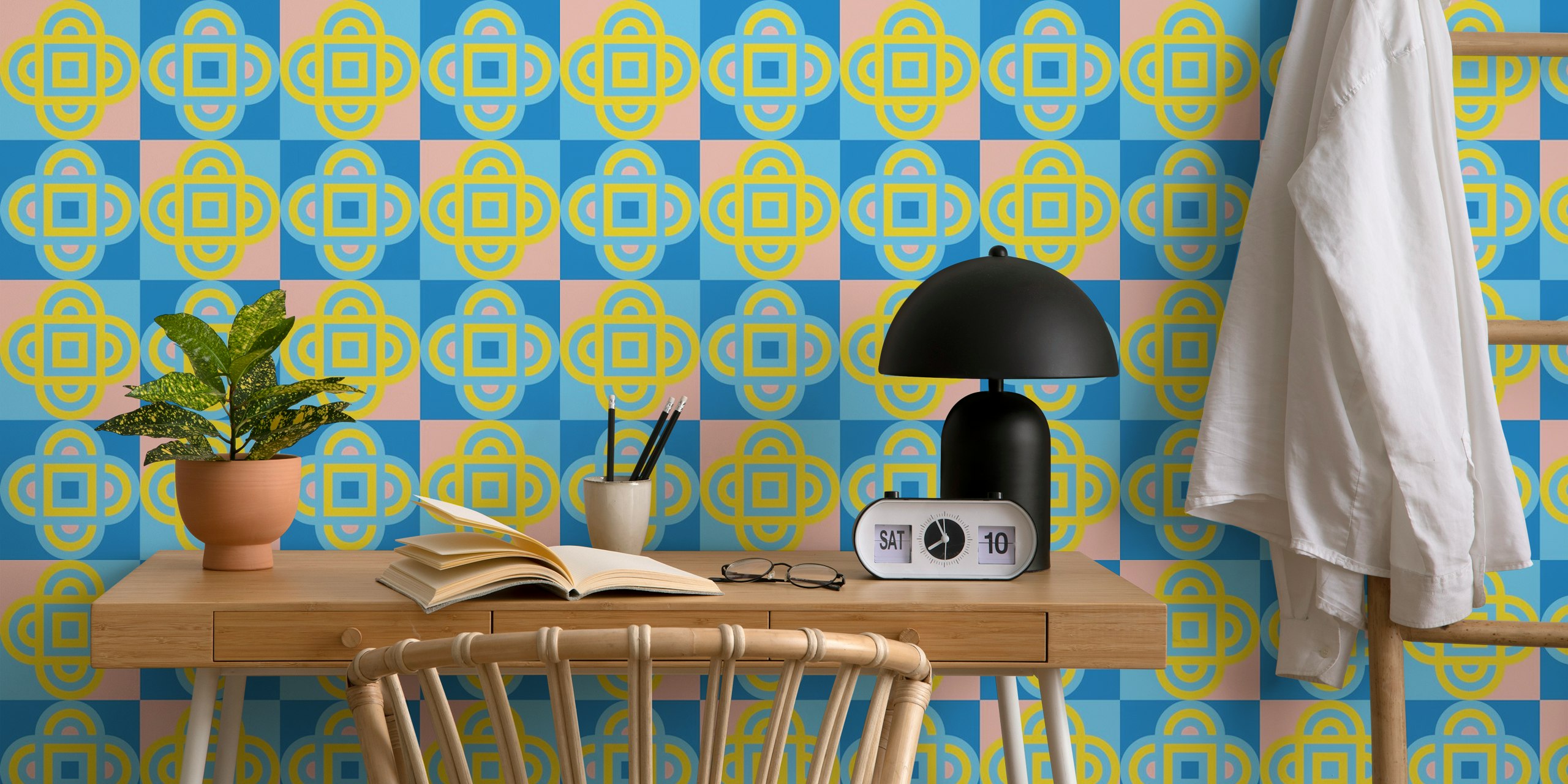 Colorful quatrefoil geometric pattern in pink, blue, and yellow wallpaper