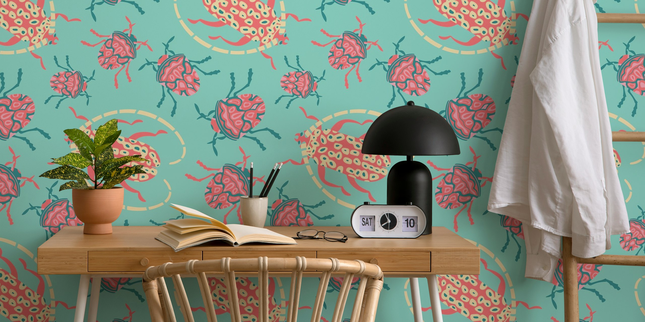 Colorful beetle designs with pink and turquoise on a patterned wallpaper