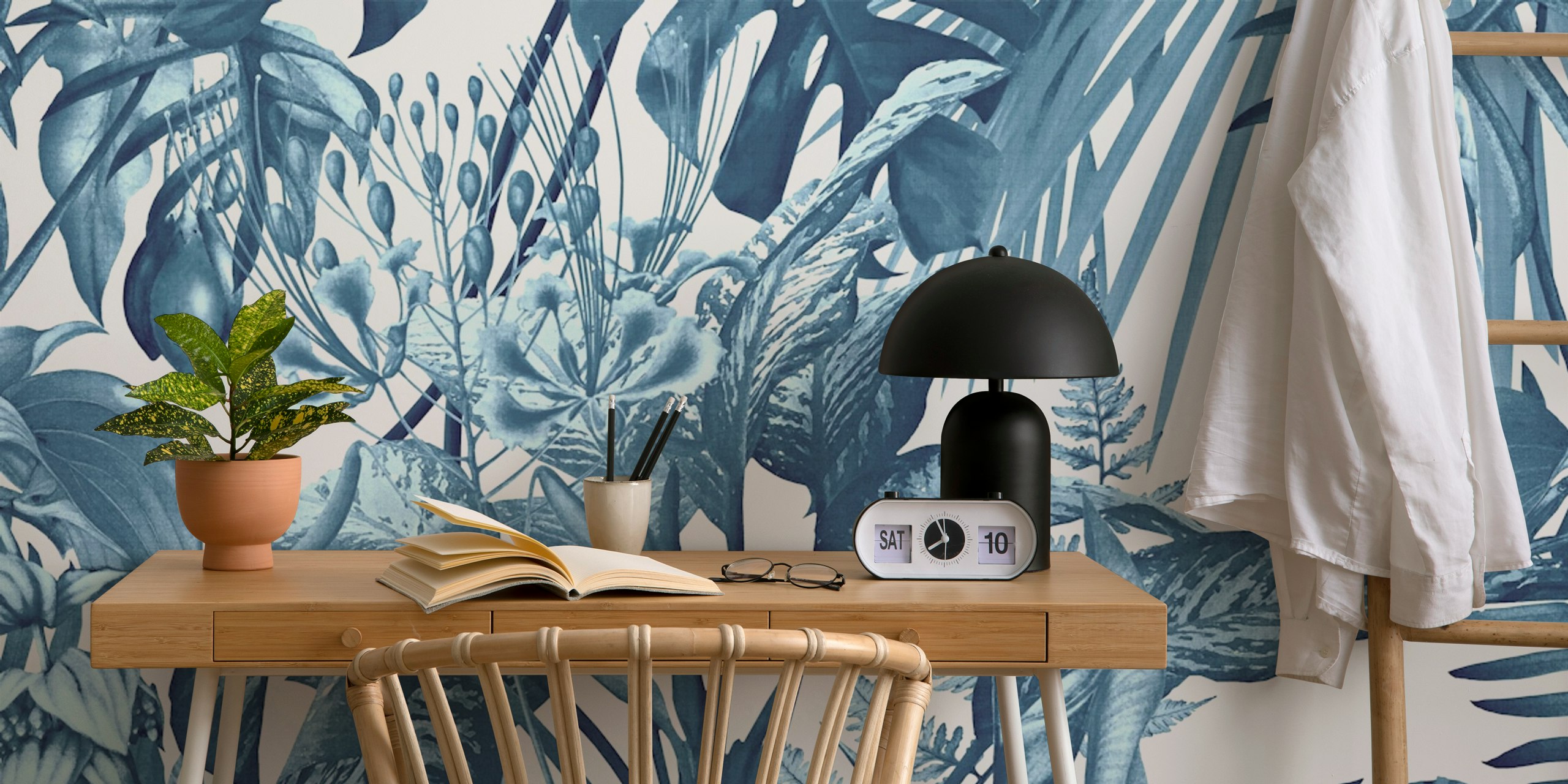 Blue tropical botanical leaves wallpaper featuring various plants