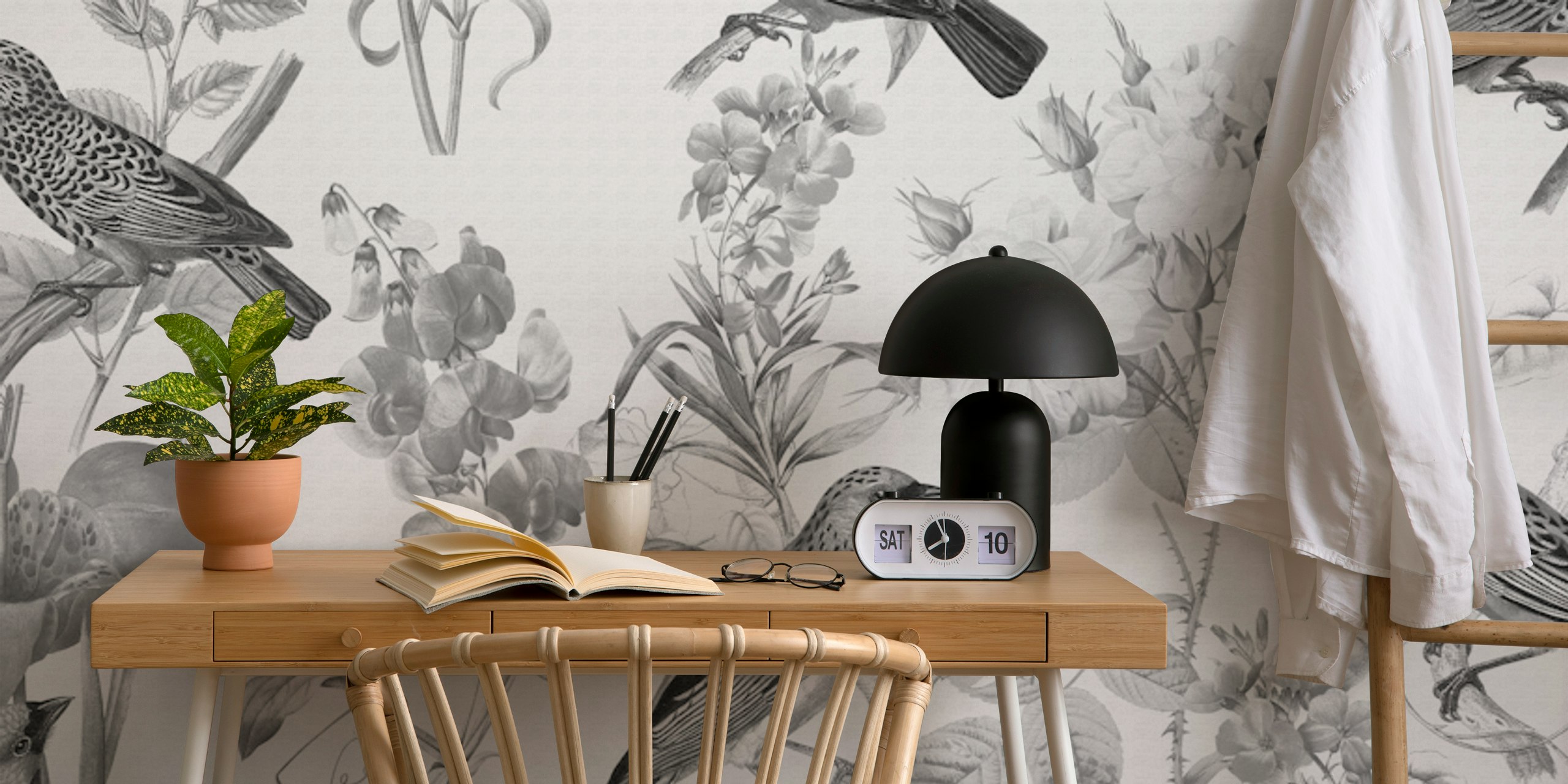 Black floral wallpaper featuring birds and flowers in monochrome style