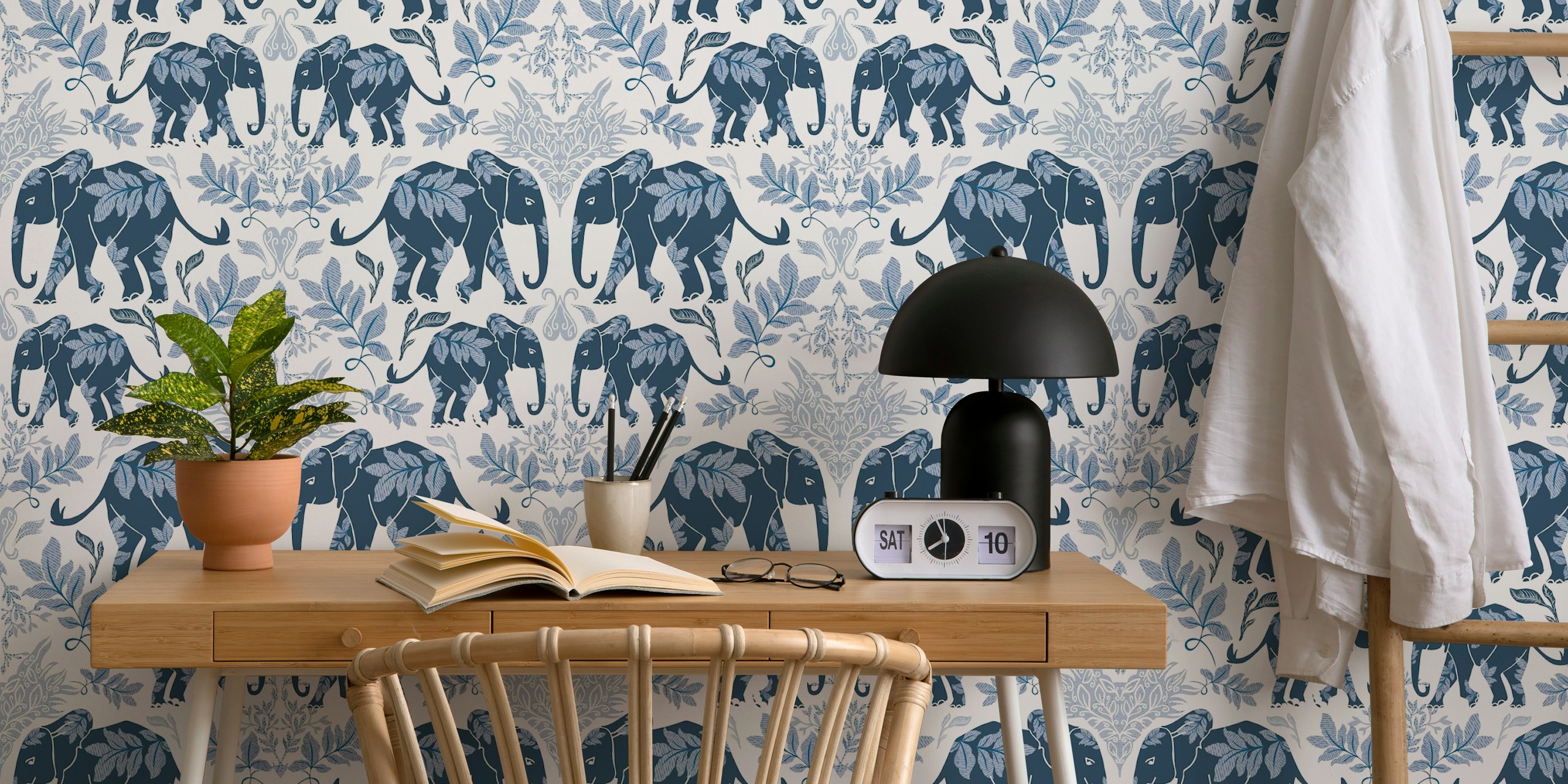Blue elephants with leaves on white background wallpaper