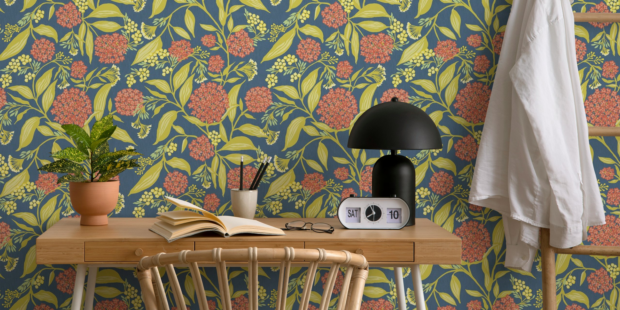 Floral patterns featuring orange and yellow flowers on indigo blue background wallpaper.