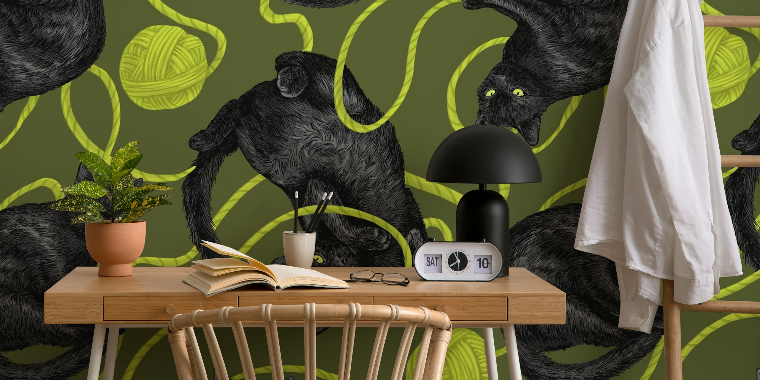 Black cats and green balls of yarn, illustrated wallpaper