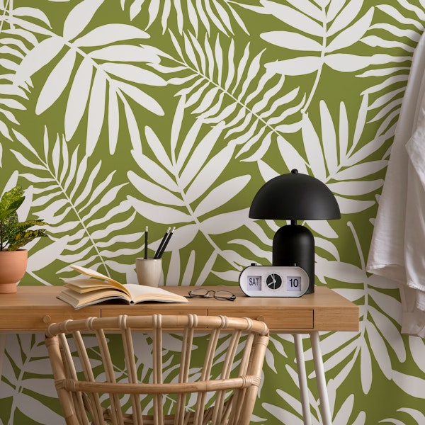 white palm leaves on green
