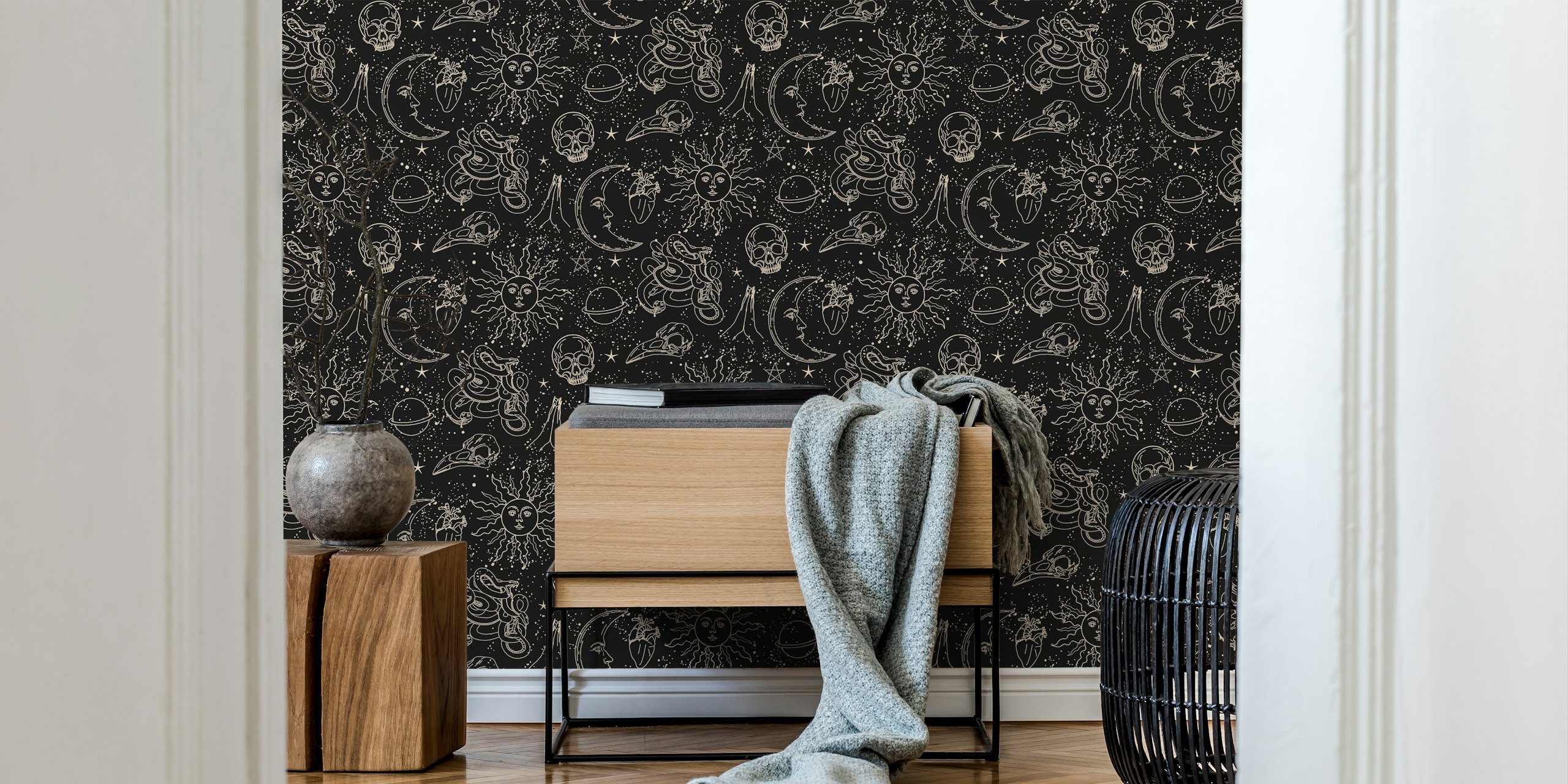 Celestial sun, moon, and star patterns in black and gold wallpaper