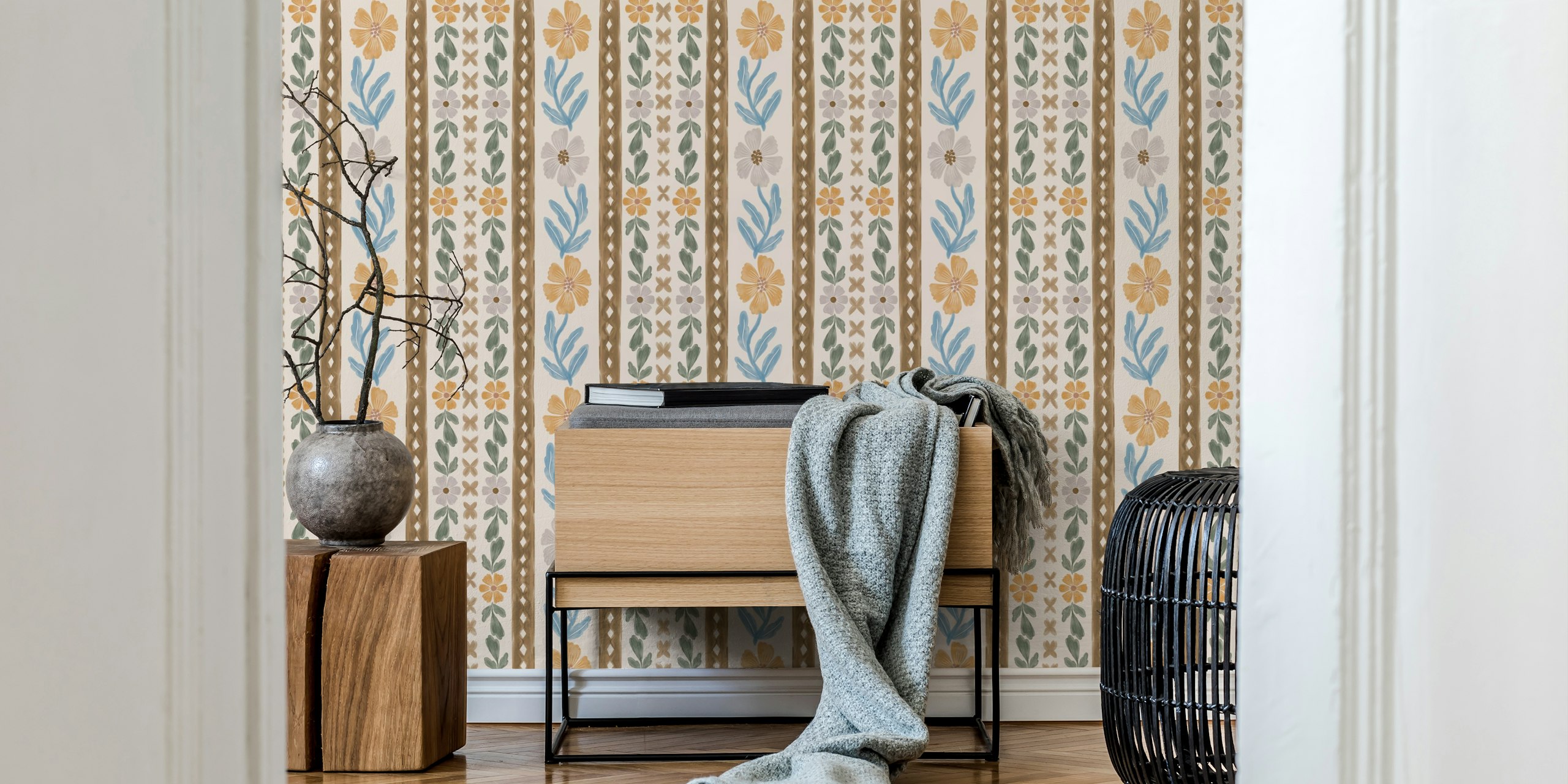 Floral patterns in soft hues of orange and blue on a cream background wallpaper