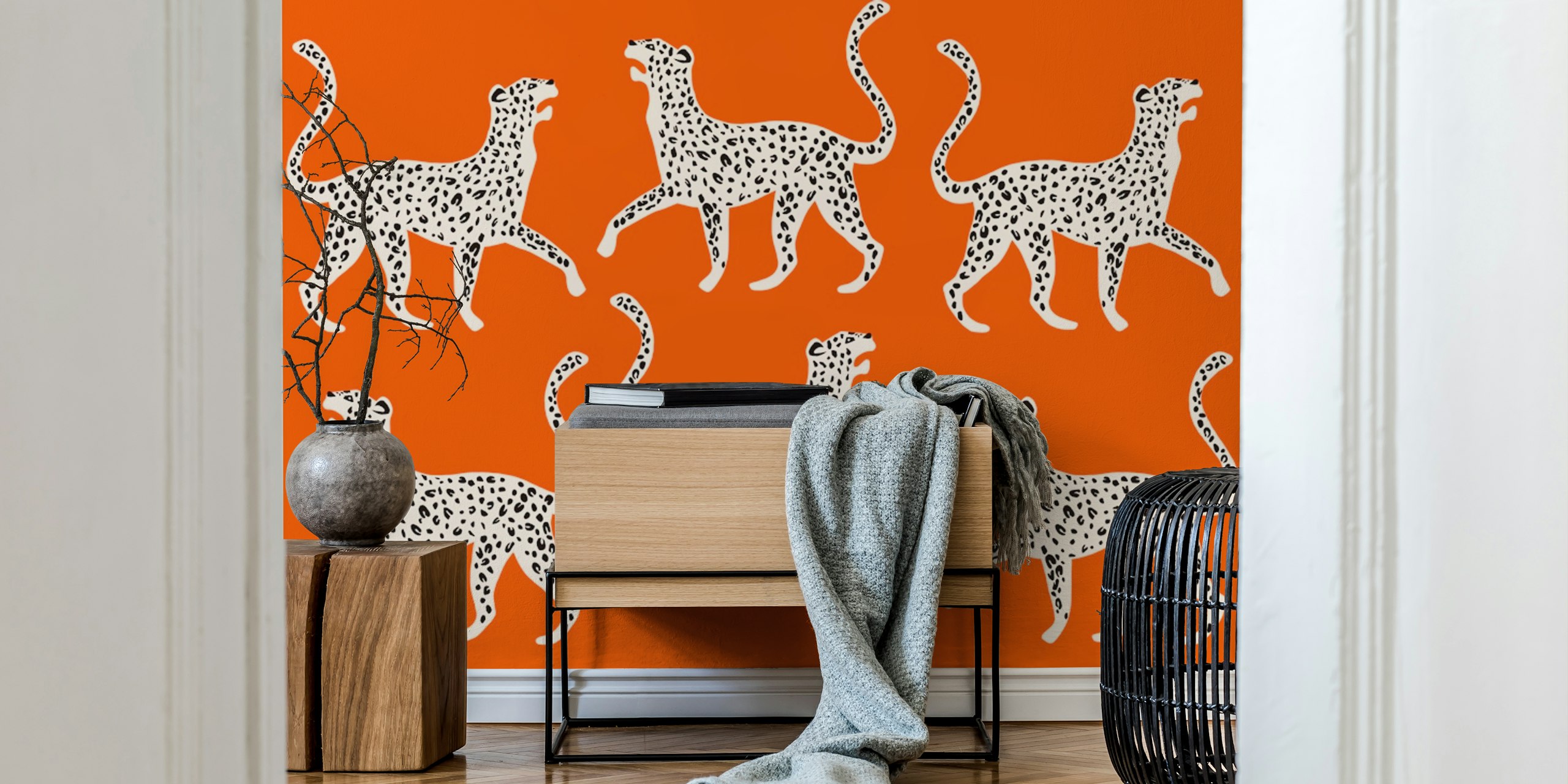 Leopard print in white and black on vibrant orange wallpaper