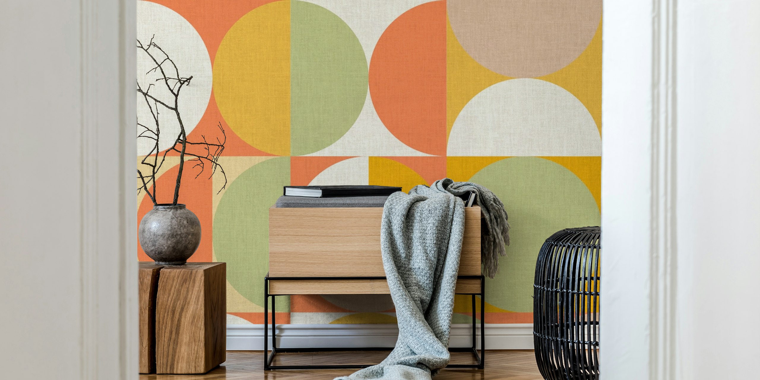 Geometric pattern wallpaper with circles in orange, yellow, green, and cream.