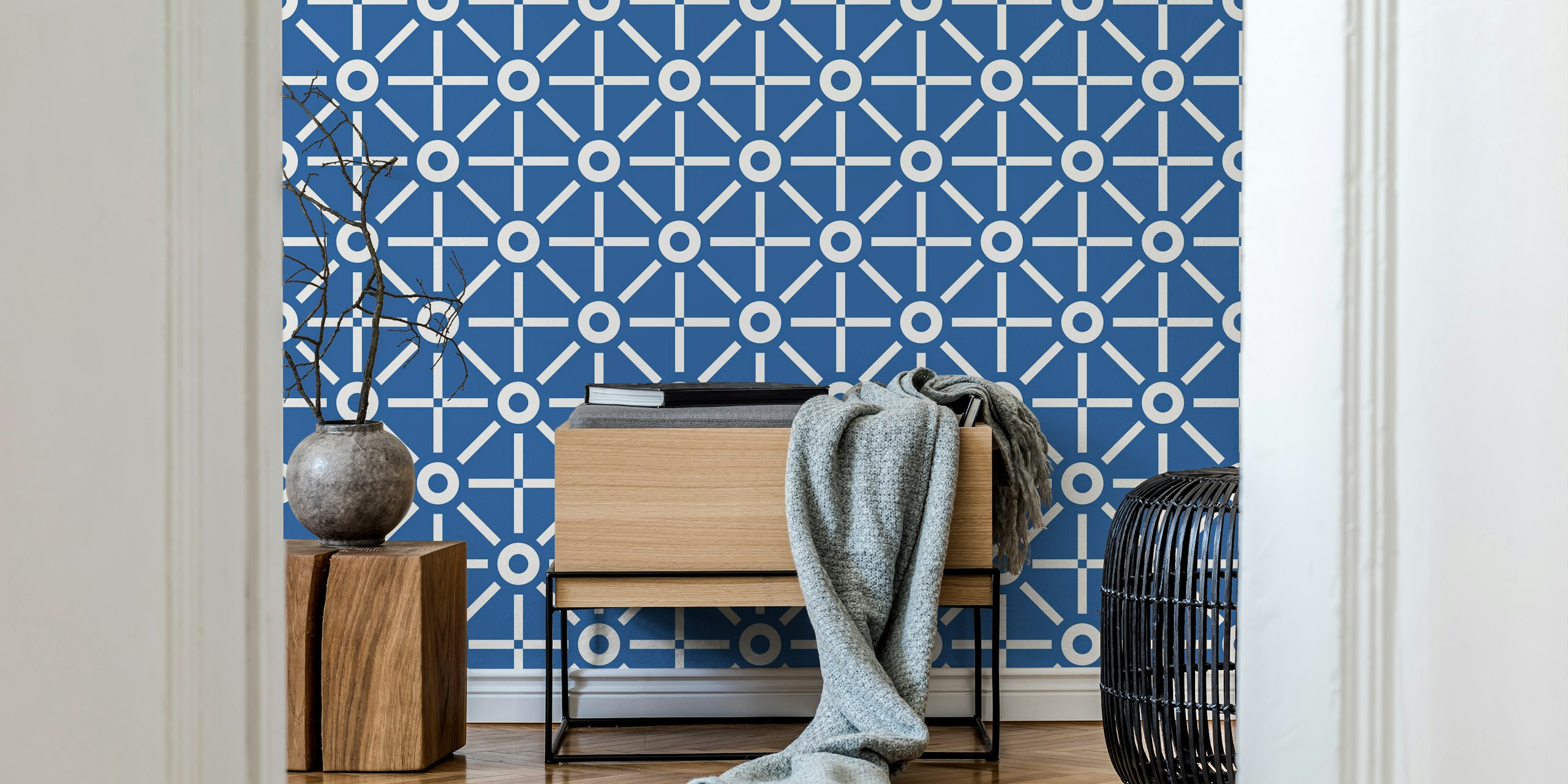 Blue geometric pattern wallpaper featuring white shapes.