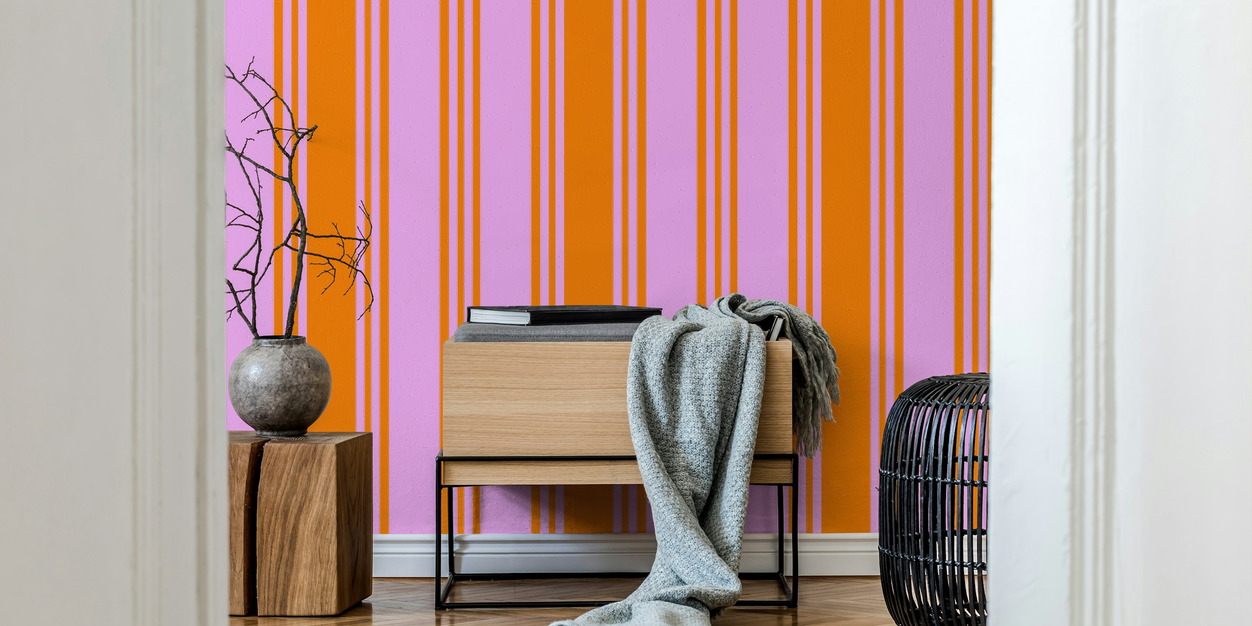 Bold orange and pink striped wallpaper in a room