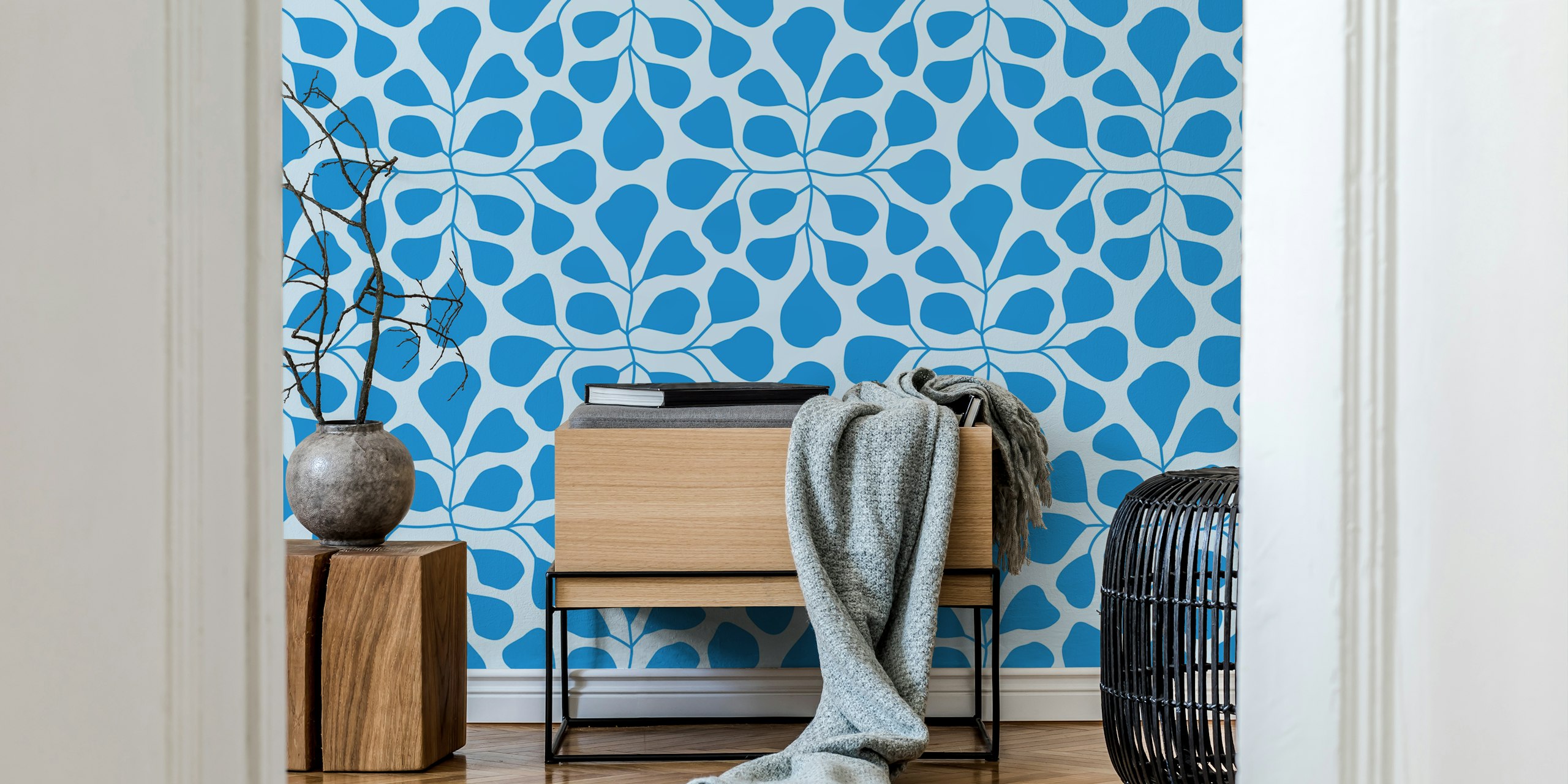 Large blue leaves pattern on light blue background wallpaper